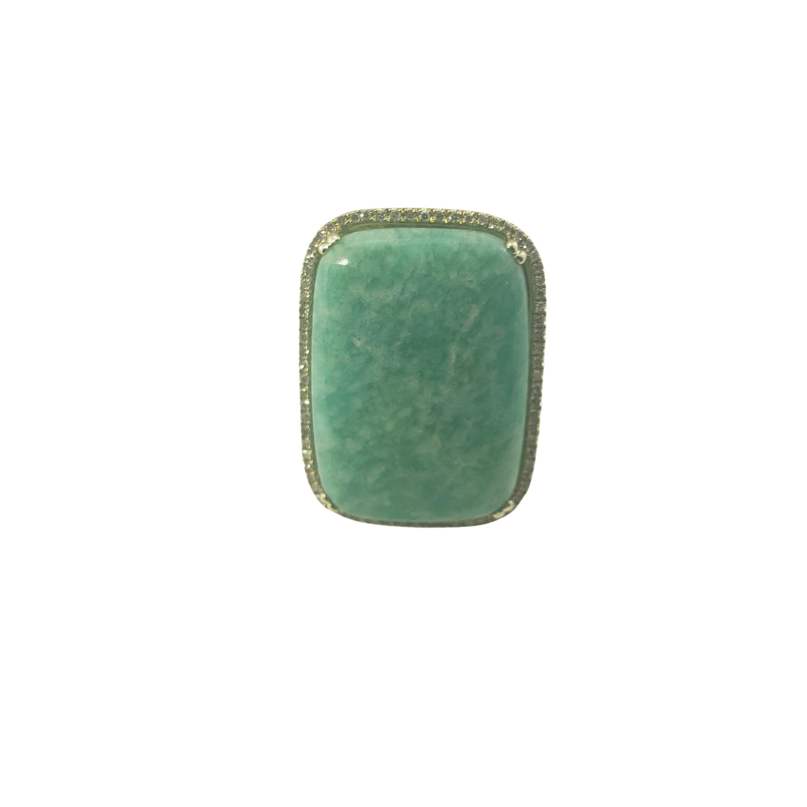 Vintage 14 Karat Yellow Gold Amazonite and Diamond Ring Size 6.5-

This lovely ring feature one rectangular cabochon cut amazonite (25 mm x 18 mm) surrounded by 74 round single cut diamonds set in classic 14K yellow gold. Top of ring measures 27 mm