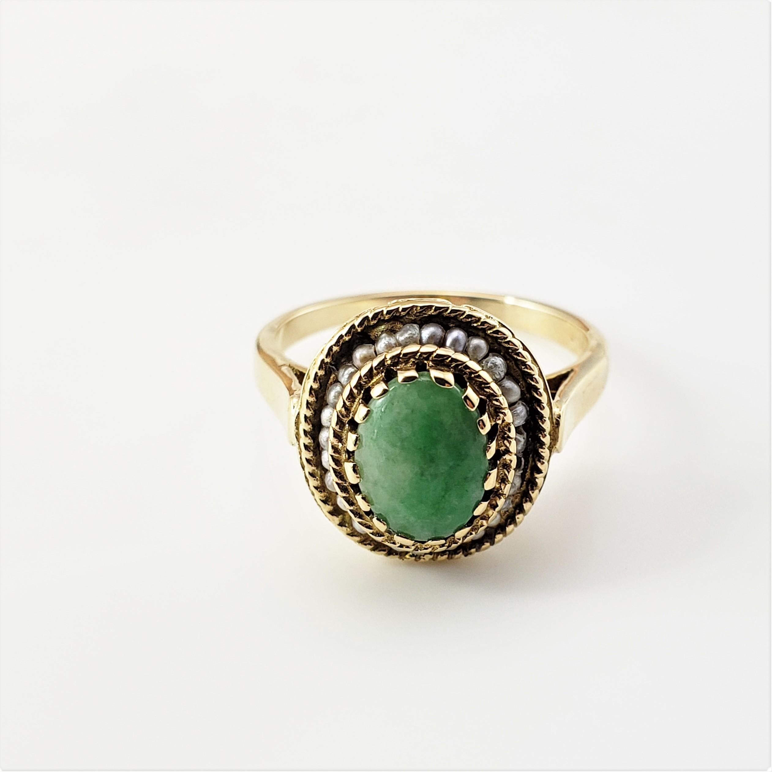 14 Karat Yellow Gold Jade and Seed Pearl Ring Size 6.25-

This lovely ring features one oval jade stone (9 mm x 7 mm) surrounded by seed pearls and set in beautifully detailed 14K yellow gold.
Shank: 2 mm.

Ring Size: 6.25

Weight:  2.5 dwt. / 3.9