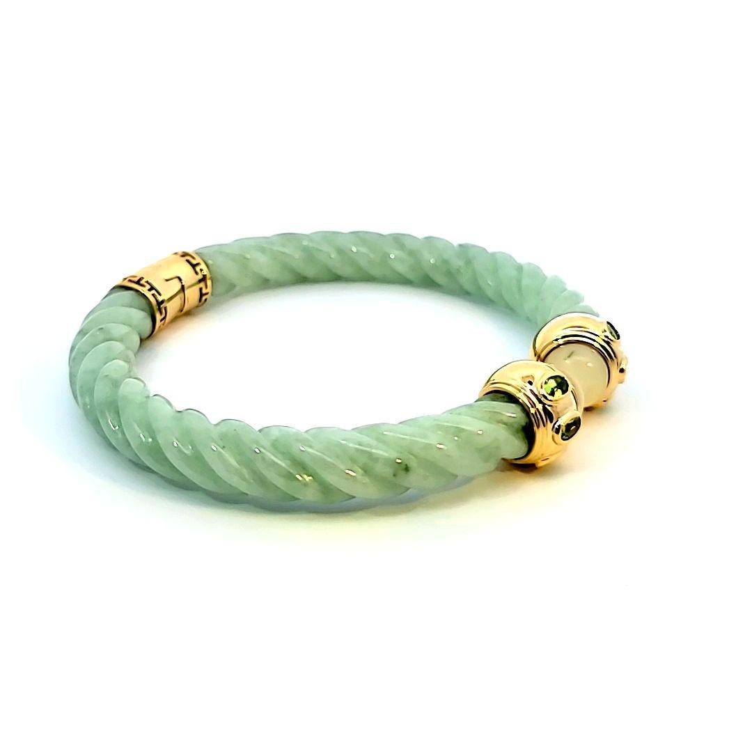 This beautiful twisted rope style jade bracelet supports yellow gold and gemset end caps. 