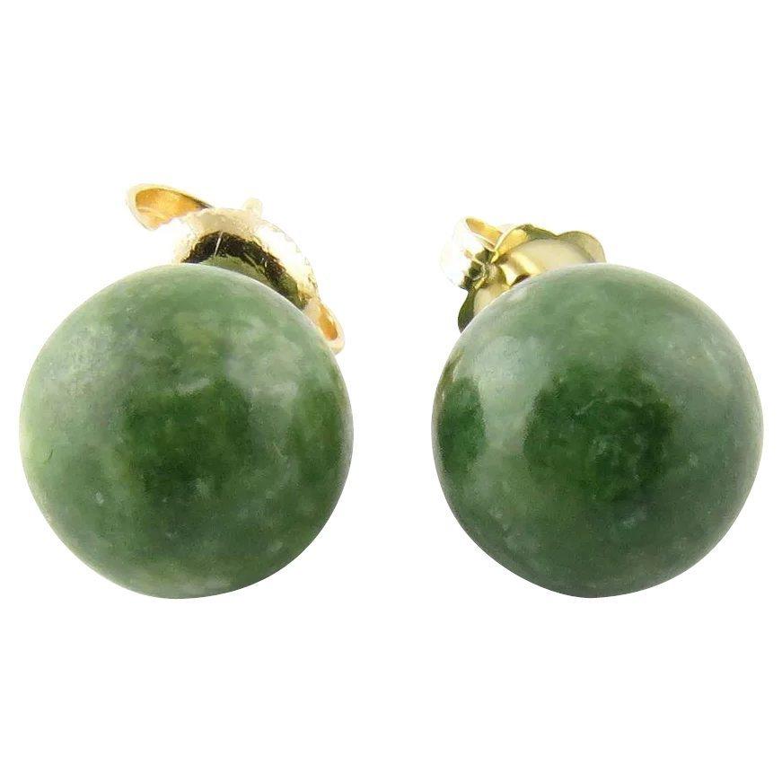 Vintage 14 Karat Yellow Gold Jade Earrings- These lovely earrings each feature one jade bead set in classic 14K yellow gold. Push back closures. Size: 8 mm Weight: 1.3 dwt. / 2.1 gr. Stamped: 14K Very good condition, professionally polished.