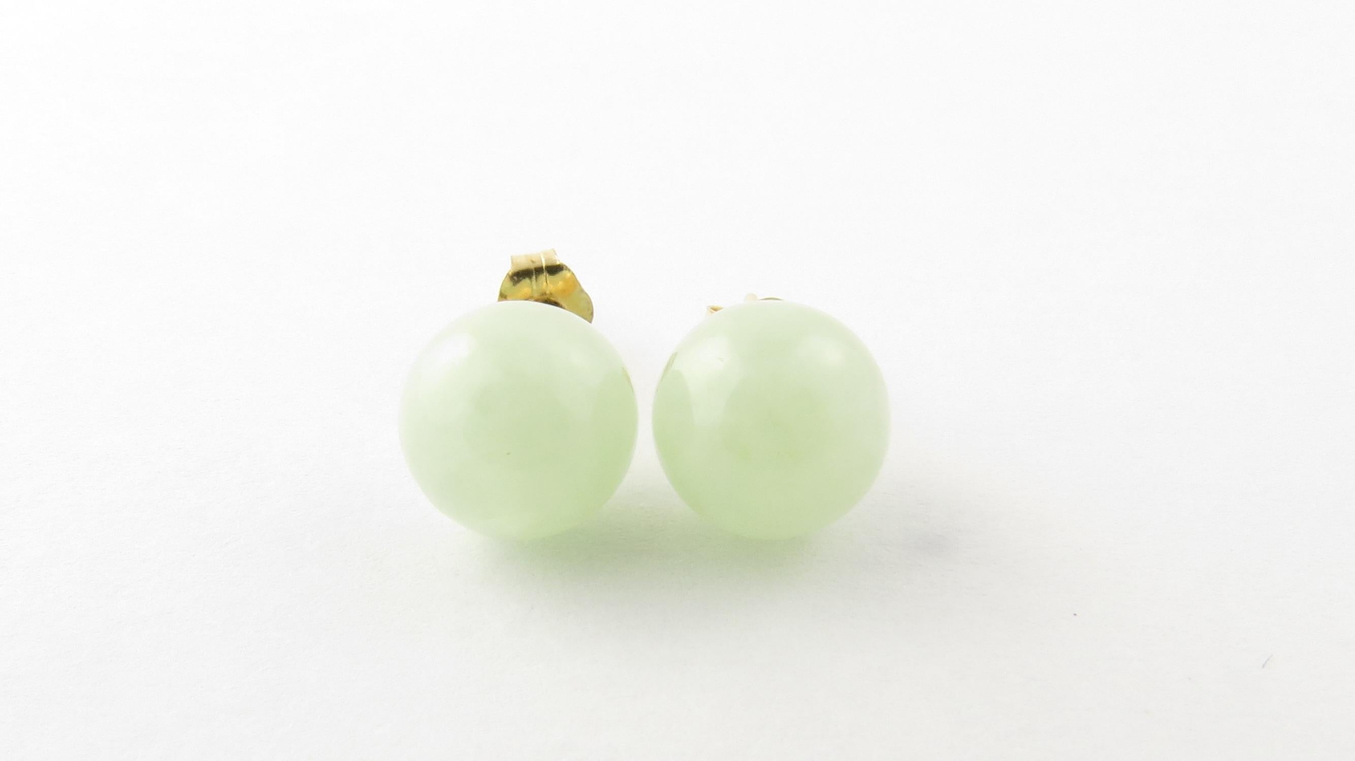 Vintage 14 Karat Yellow Gold Jade Stud Earrings

These lovely earring each feature one jade gemstone set in 14K yellow gold. Push back closures.

Size: 8 mm

Weight: 1.2 dwt. / 2.0 gr.

Stamped: 14K

Very good condition, professionally polished.