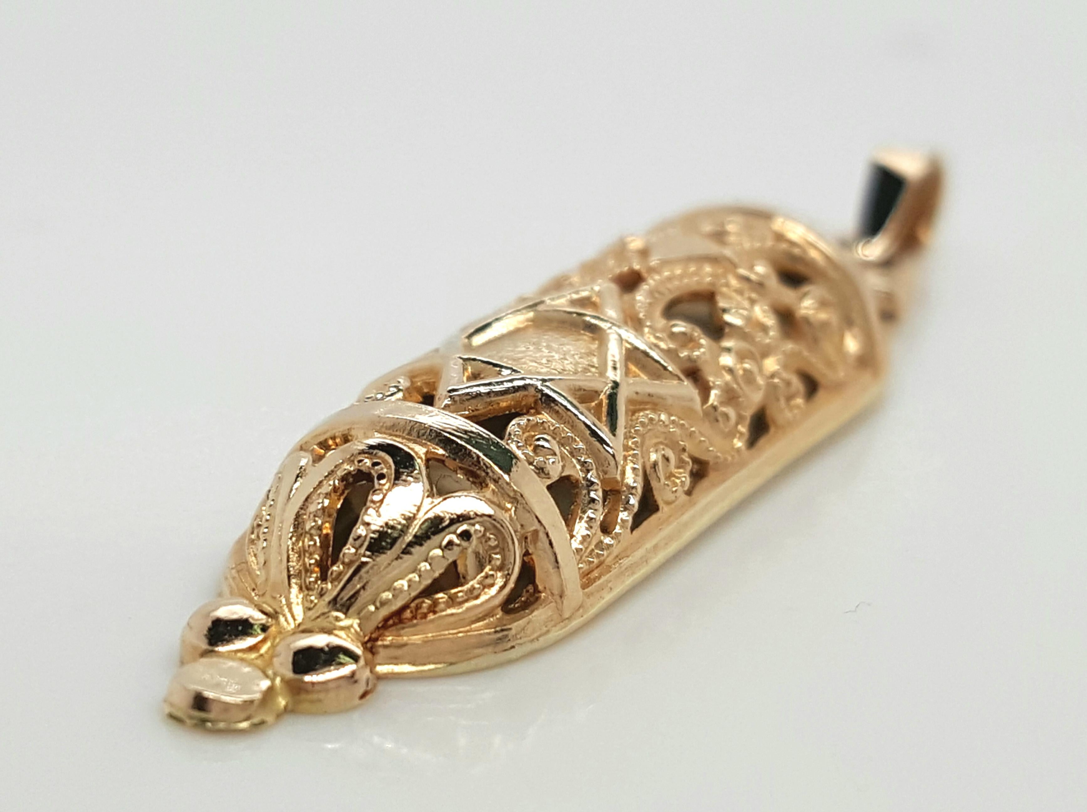 Vintage Golden Jewish Jewelry Torah Mezuzah Scroll Pendant Charm

Crafted of solid 14K yellow gold, this beautiful Jewish Jewelry Torah Mezuzah Scroll charm is truly one of a kind. The charm features beautiful engravings and details all over it,