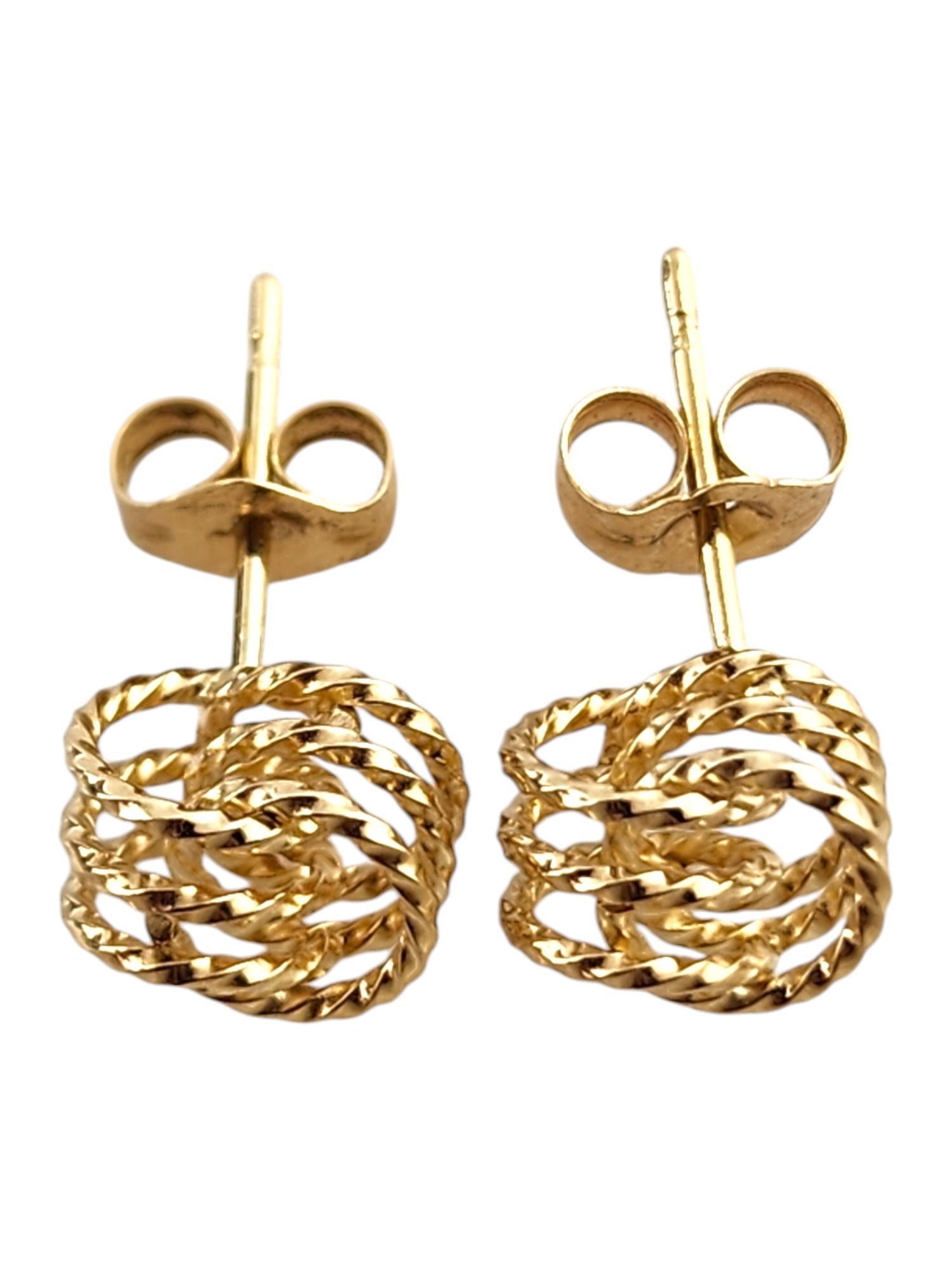 14 Karat Yellow Gold Knot Stud Earrings

These beautiful studs were meticulously crafted from 14K yellow gold to form knots!

Size: 6.8mm X 7.81mm X 7.0mm

Weight: 1.23 g/ 0.79 dwt

Hallmark: 14K

Very good condition, professionally polished.

Will