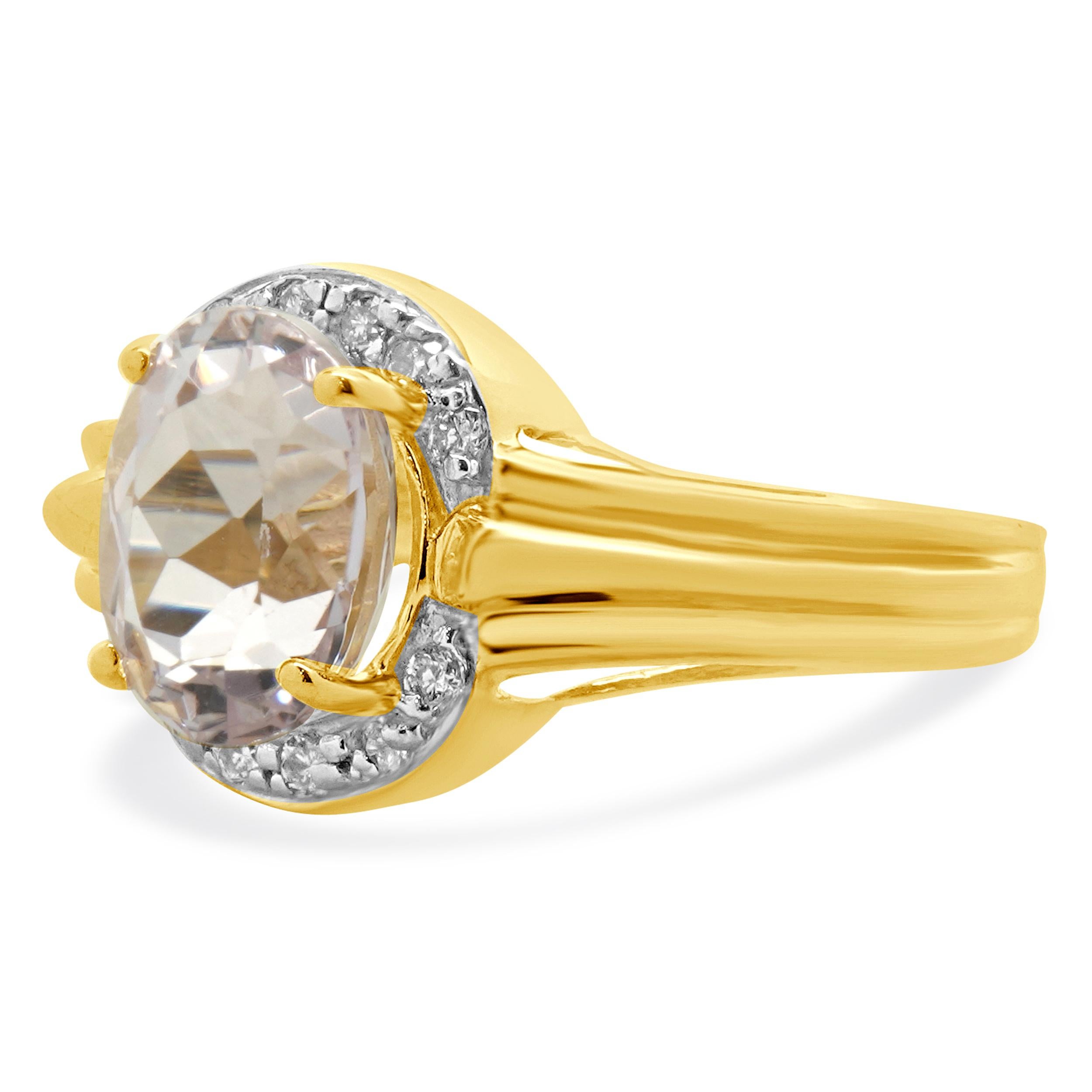 Designer: custom
Material: 14K yellow gold
Kunzite: 1 oval cut = 2.75ct
Diamond: 12 round cut = 0.18cttw
Color: H
Clarity: SI1
Ring Size: 8.5 (please allow two extra shipping days for sizing requests) 
Weight: 4.61 grams
