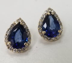 14 Karat Yellow Gold Synthetic Sapphire and Diamond Pear Shape Halos
