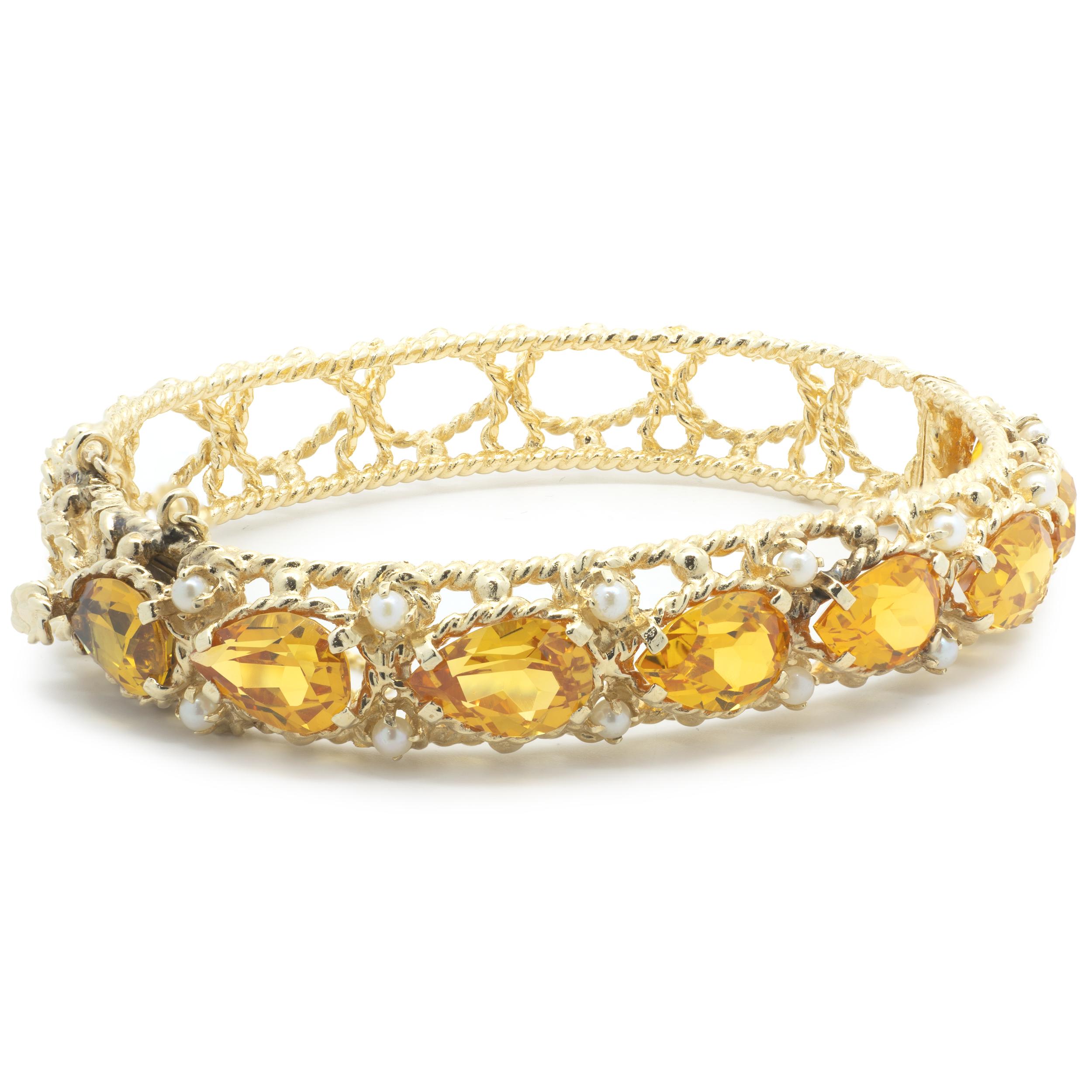 Designer: custom 
Material: 14K yellow gold
Dimensions: bracelet will fit up to a 7-inch wrist
Weight: 30.48 grams
