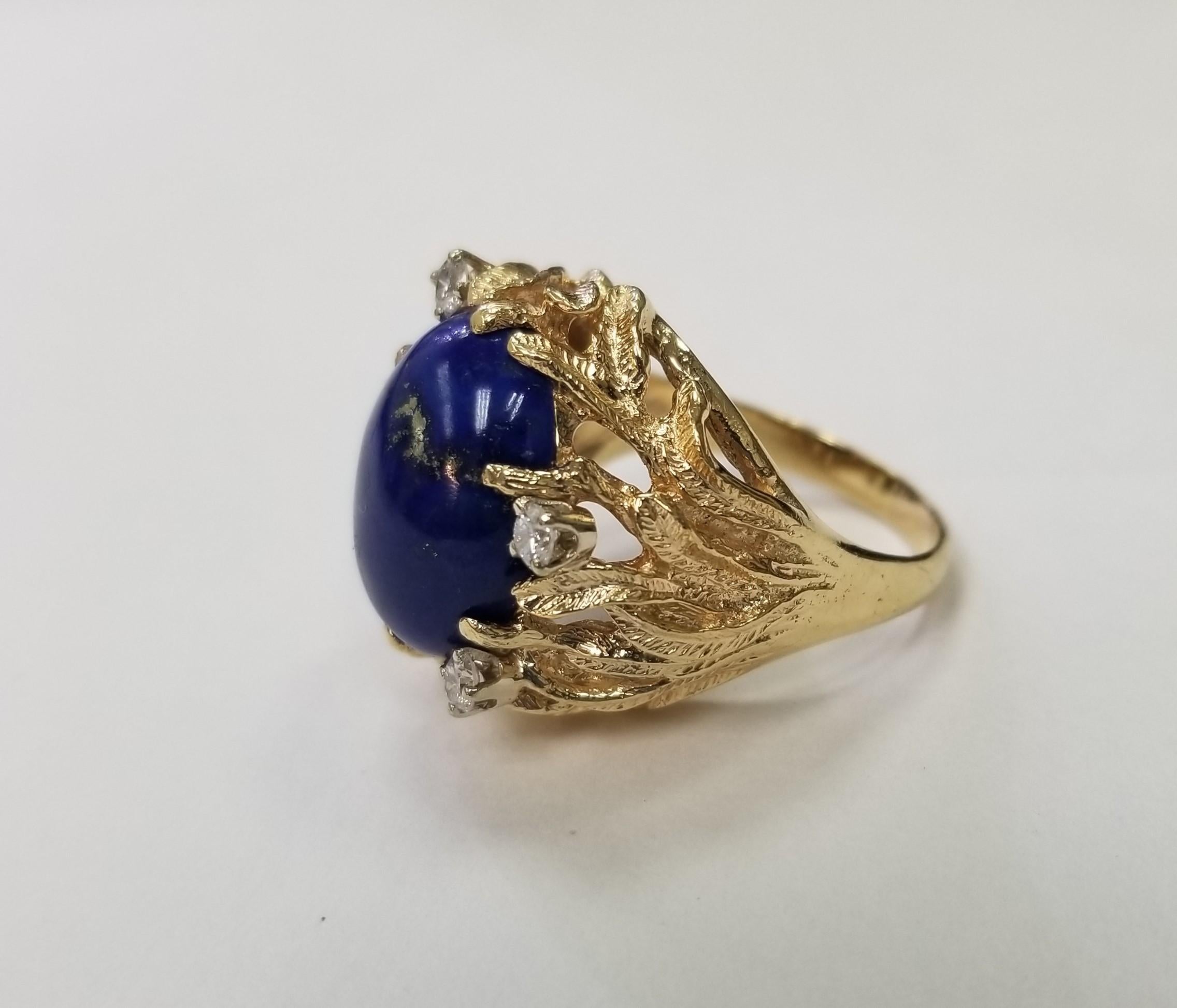 14 Karat Yellow Gold Lapis and Diamond Cocktail Ring, 1 Lapis 15 x 12mm of gem quality and 4 round full cut diamonds of very fine quality weighing .20pts.  This ring is a size 7.5 but we will size to fit for free.
