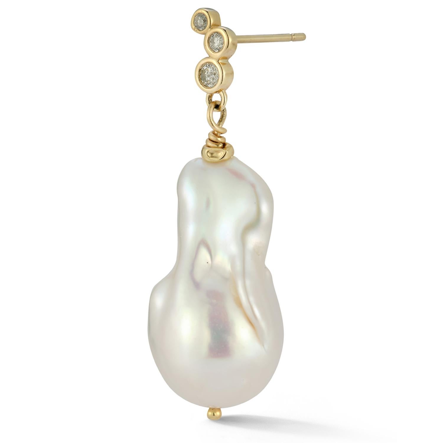 These Left and Right large Baroque pearl drop earrings with Salt and Pepper diamond studs complement each other between the warm tones from the diamonds and the lustrous white pearls. An effortless way to make a statement for any occasion in the