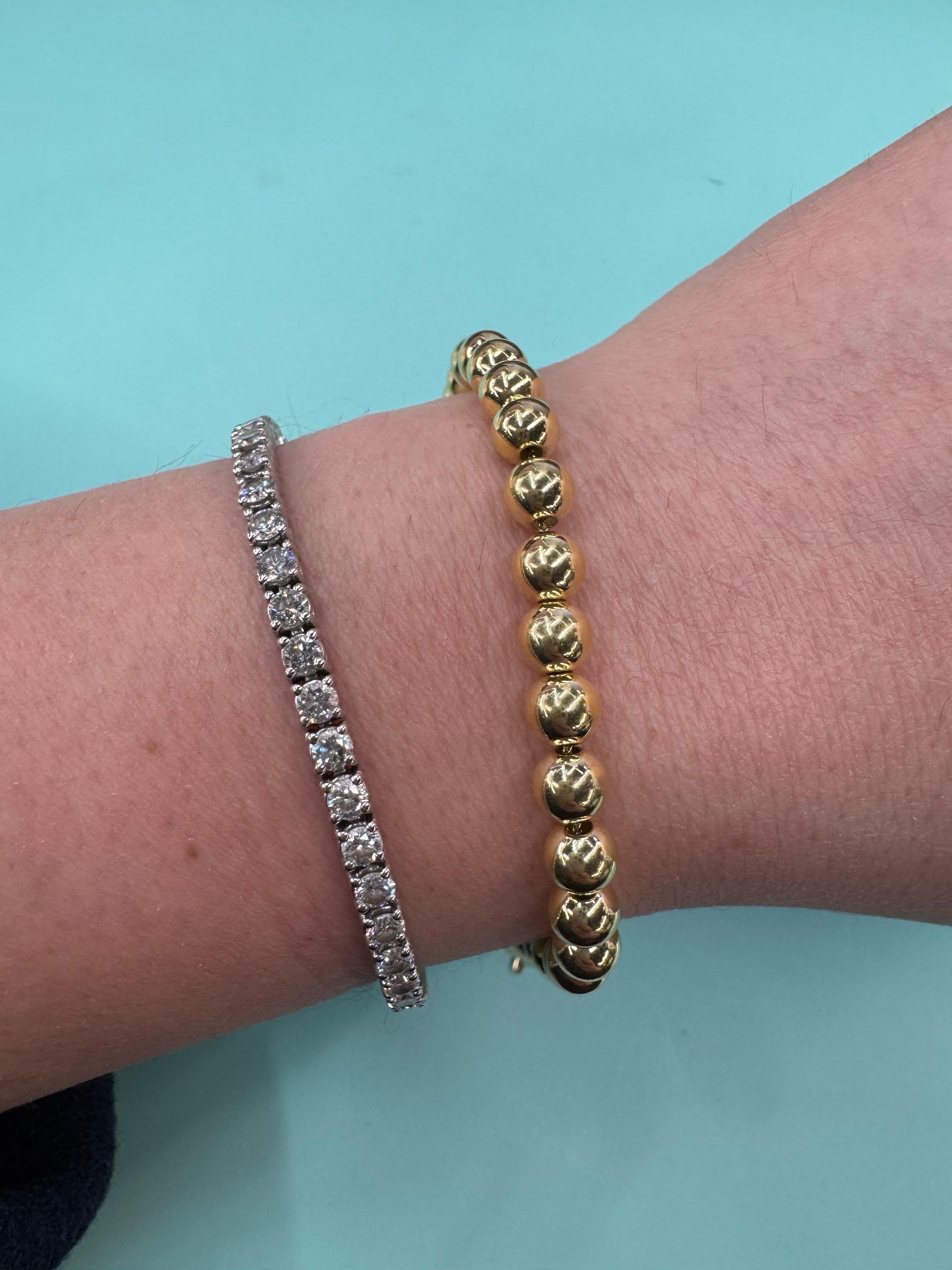 Pulsera de cuentas de oro amarillo de 14 quilates con 31 bolas muy pulidas en una pulsera de cadena,  6 mm, 5,65 gramos.

Disponible en tamaños MM más pequeño y más grande.
Mensaje para más fotos e información. 