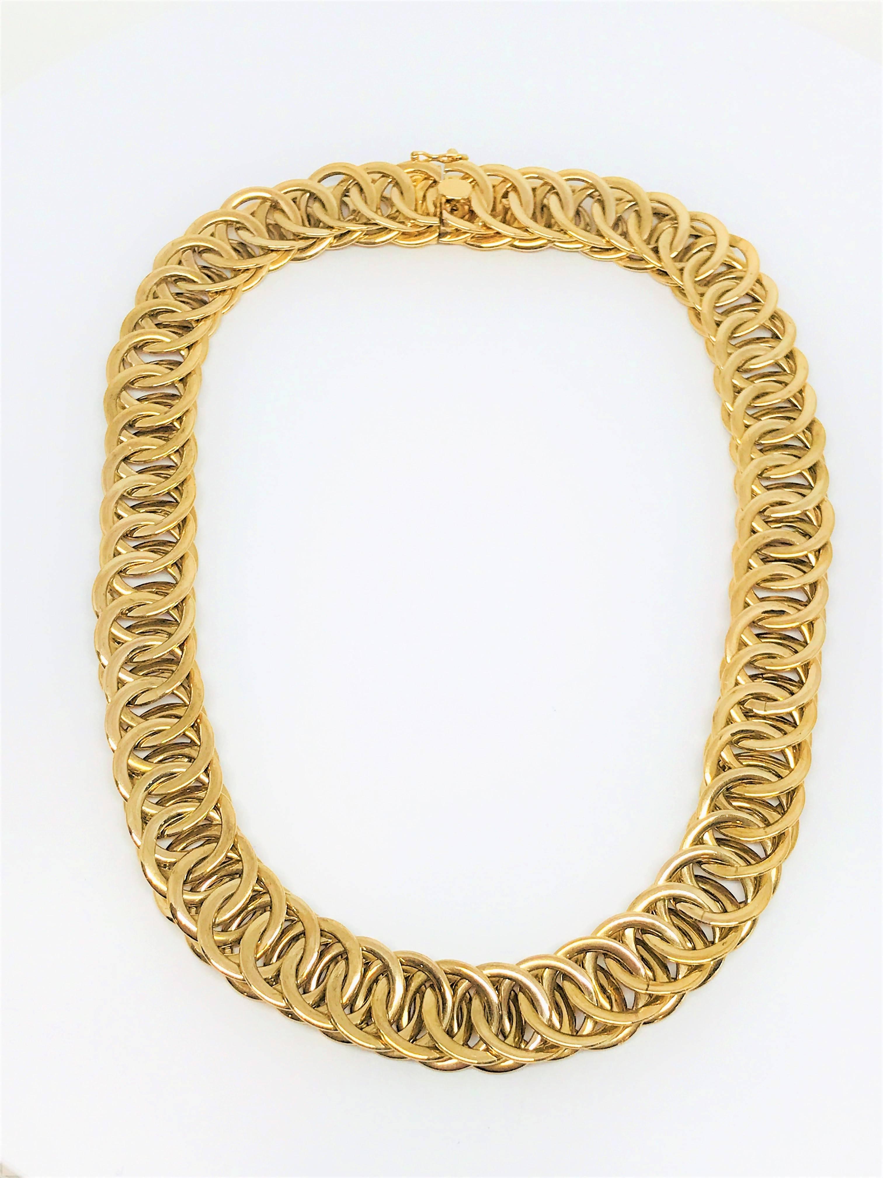 Bold and beautiful 14k yellow gold large circle link choker necklace. This heavy necklace is so comfortable on the neck! It really makes a statement and would go with any outfit or occasion. The hidden box clasp keeps a seamless look to the