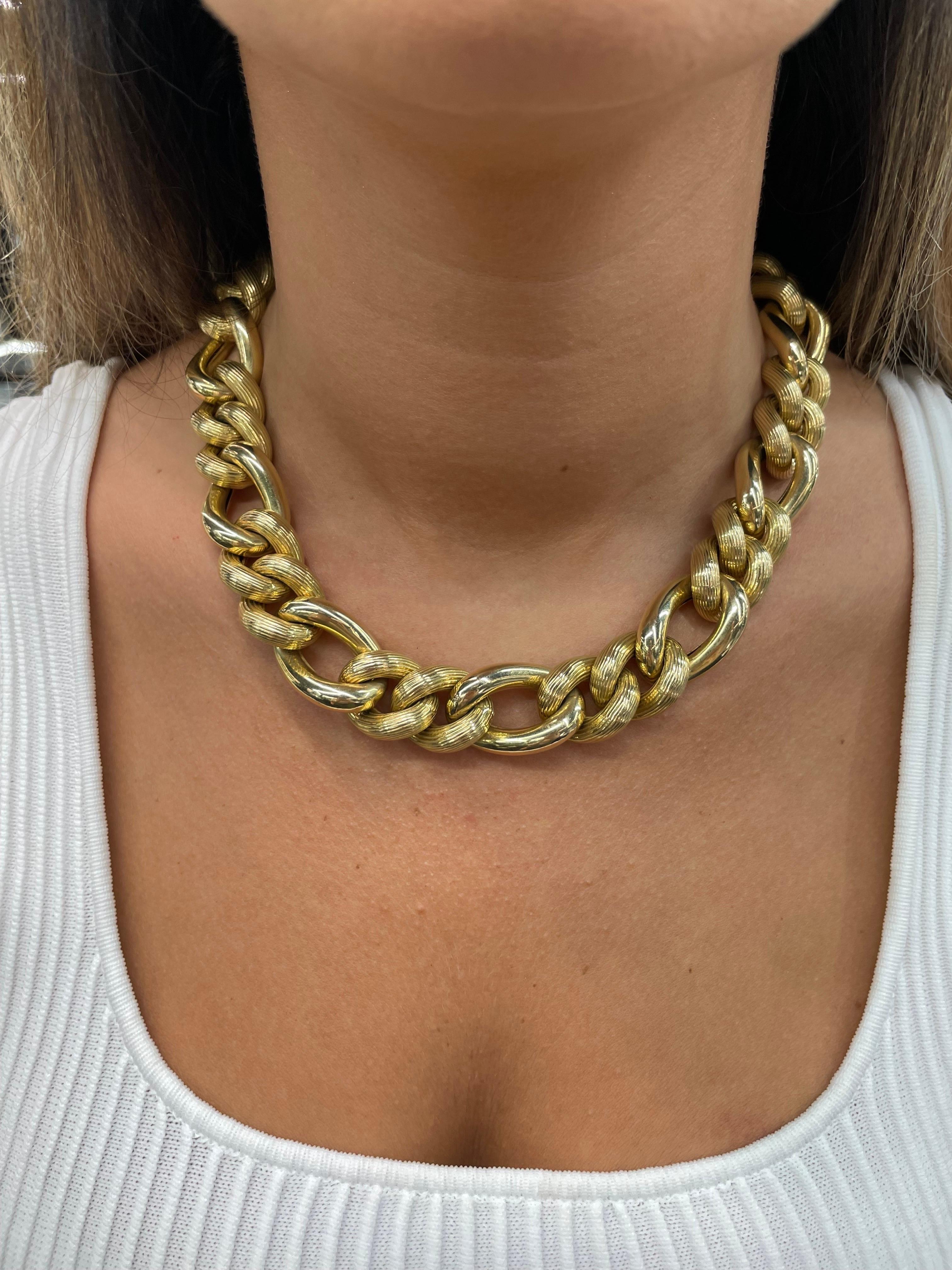 Bold 14 Karat Yellow Gold necklace featuring 34 Figaro large links weighing 139 grams. 
Great conversation piece! 