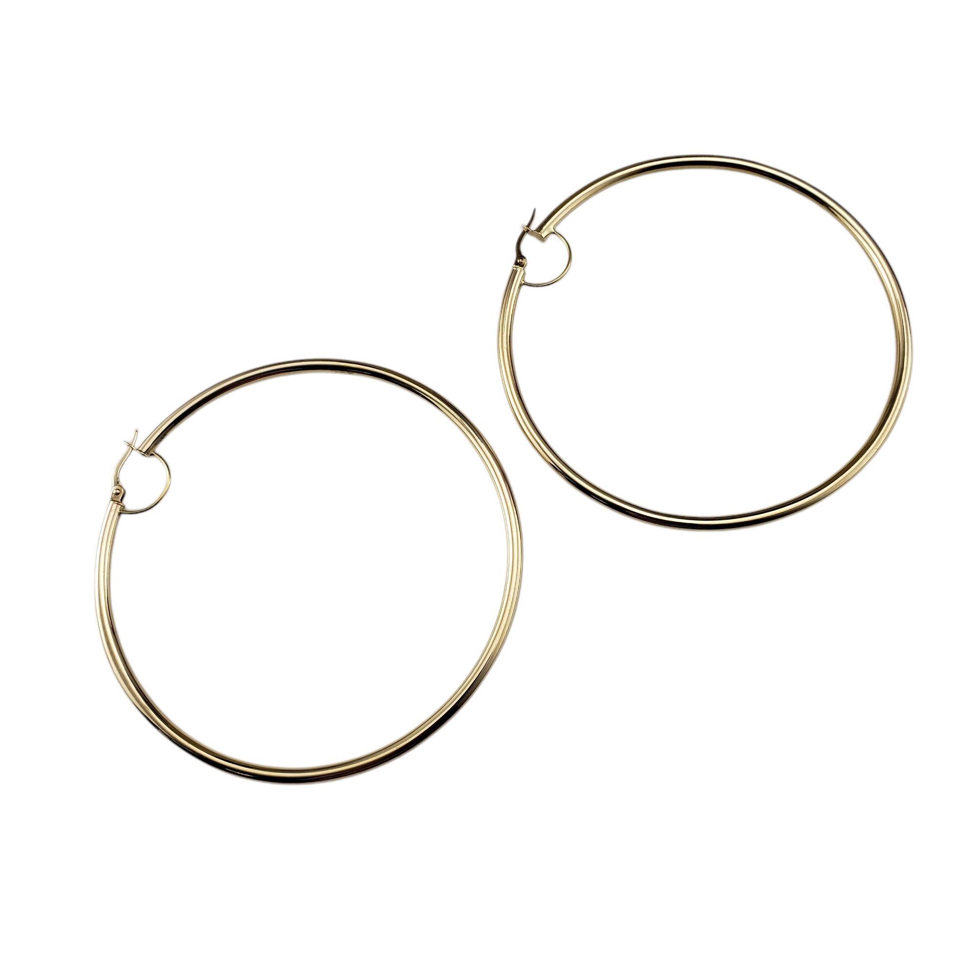 14 Karat Yellow Gold Large Hoop Earrings-

These extra large 14K yellow gold hoop earrings are a bold and timeless statement piece that blend luxury with everyday wearability.

Width: 3 mm.

Size: 3 inches in diameter

Weight: 4.0 dwt./ 6.2