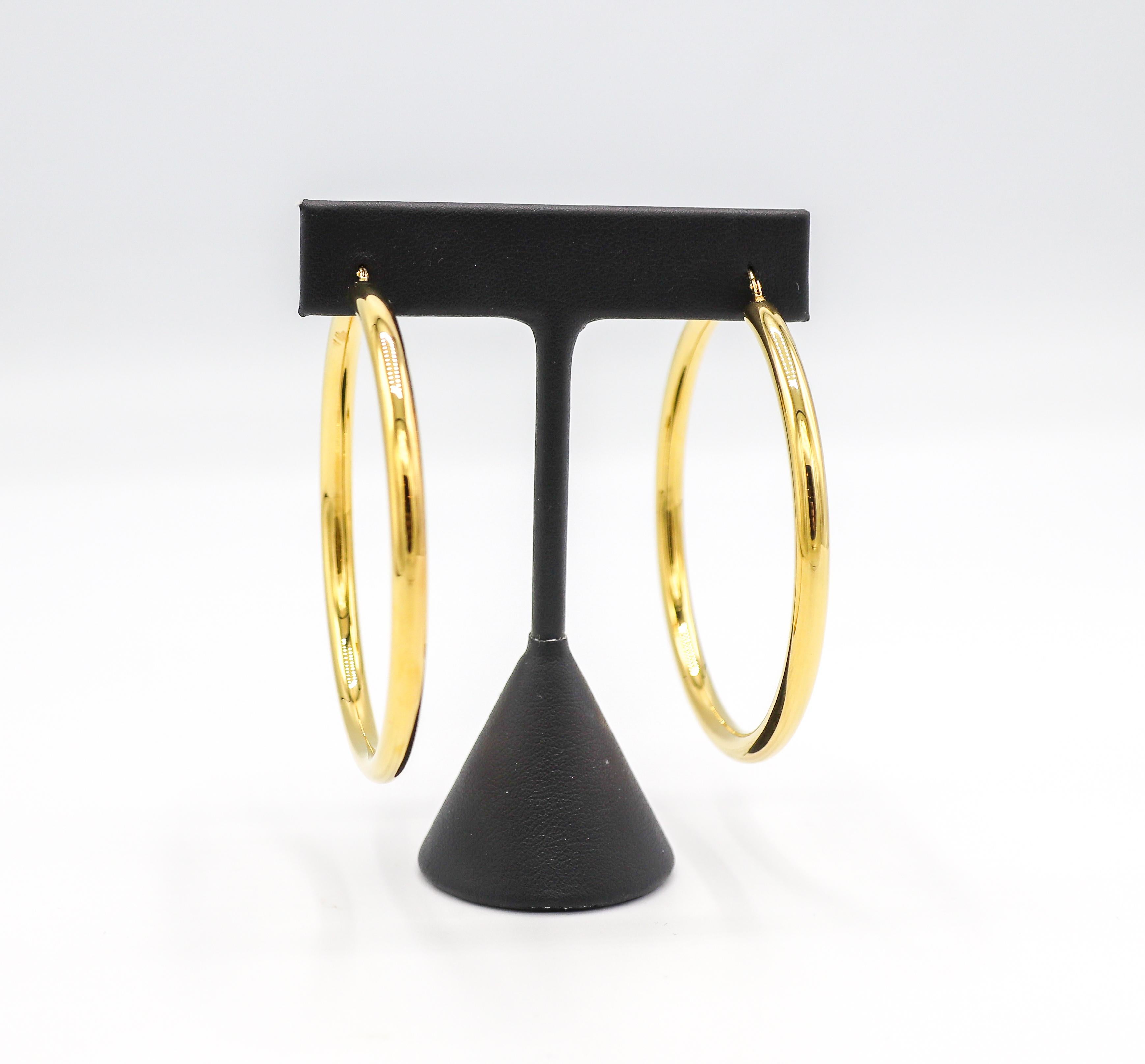 14 Karat Yellow Gold Large Hoop Earrings 
Metal: 14k yellow gold
Weight: 16.35 grams
Diameter: 57mm
Width: 4.2mm
