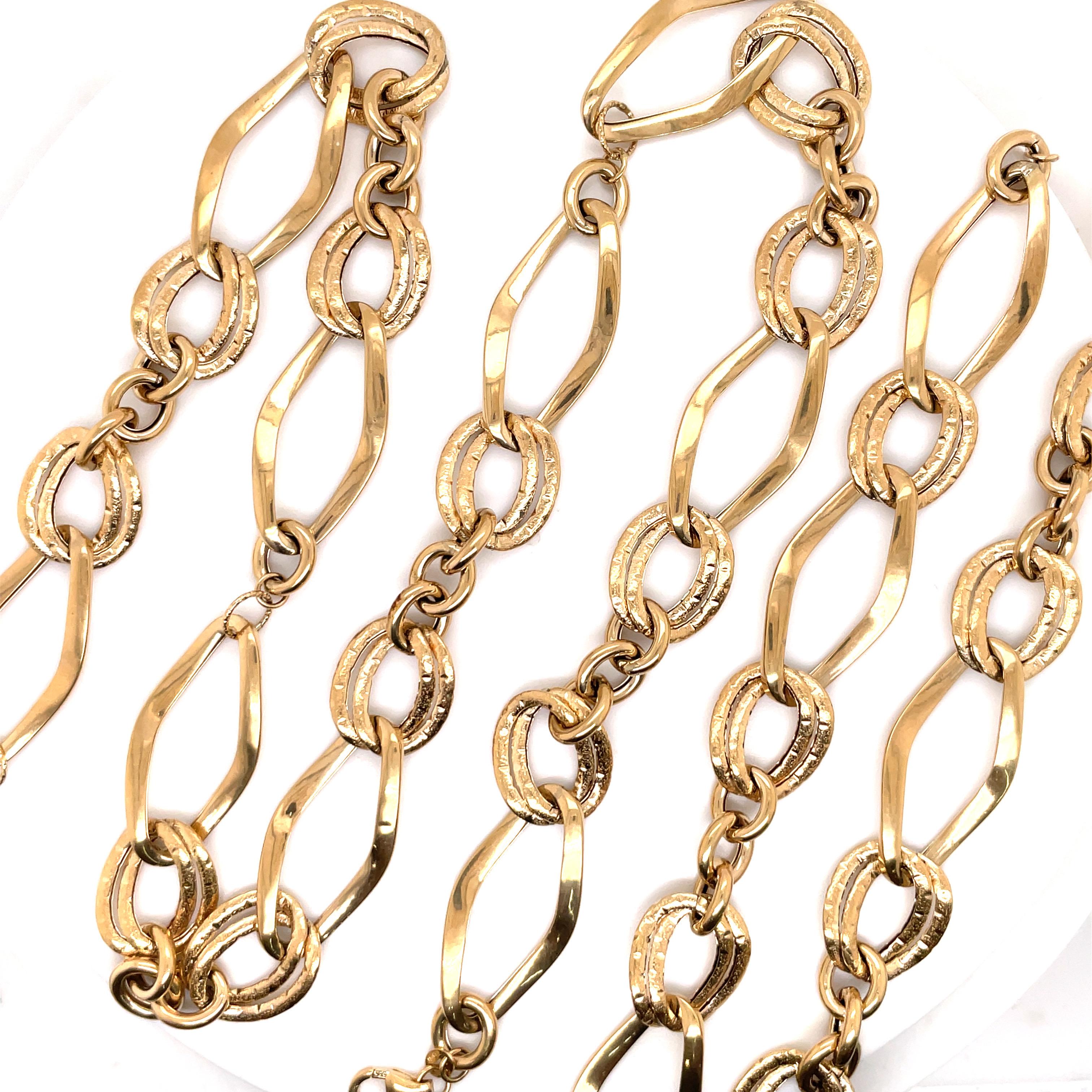 14 Karat Yellow Gold link set featuring one necklace measuring 21.5 inches and two bracelets; one measuring 6.5 inches and the other 7.13 inches. The whole set can be combined into a 37 Inch necklace or the two bracelets making collar necklace. Made
