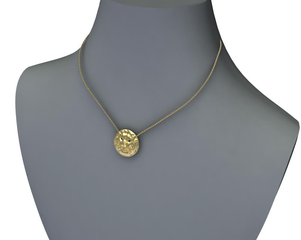 Tiffany Designer , Thomas Kurilla created this 14k Yellow Gold Lion Pendant, For the Leo in your life. Matte finish Lion ,21 mm diameter 2 sapphires ,1.4mm each on a 18 inch chain 1.5mm wide. This is a womens chain. 

 For men use 1.9 cable chain