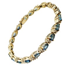 14 Karat Yellow Gold London Blue Topaz and Diamond Bracelet