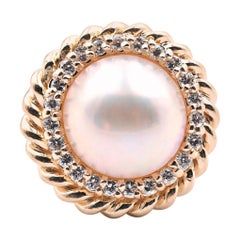 14 Karat Yellow Gold Mabe Pearl and Diamond Halo Twisted Ring