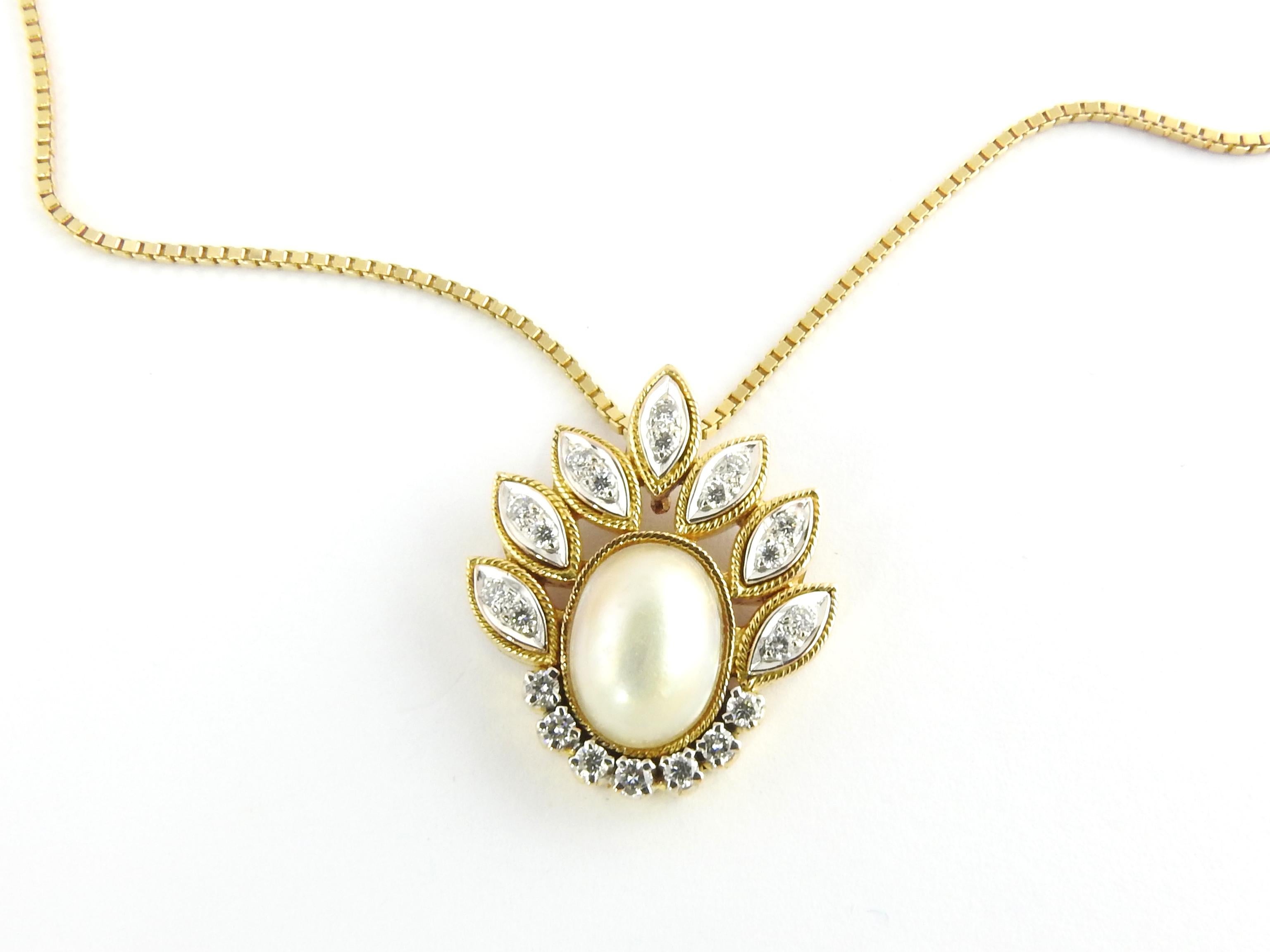 14 Karat Yellow Gold Mabe Pearl and Diamond Pendant Necklace-

This lovely pendant features one oval Mabe pearl (11 mm x 9 mm) accented with 21 round brilliant cut diamonds set in beautifully detailed 14K yellow gold.  Suspends from a classic 14K