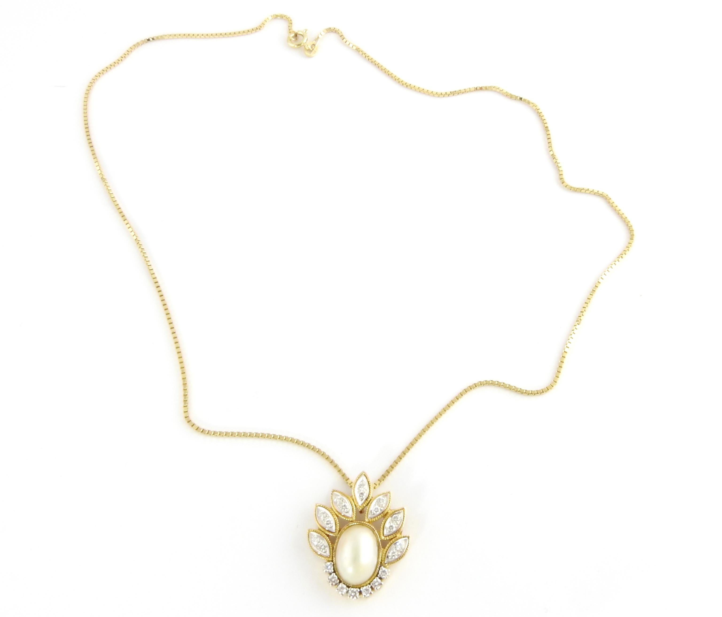 Brilliant Cut 14 Karat Yellow Gold Mabe Pearl and Diamond Pendant Necklace For Sale