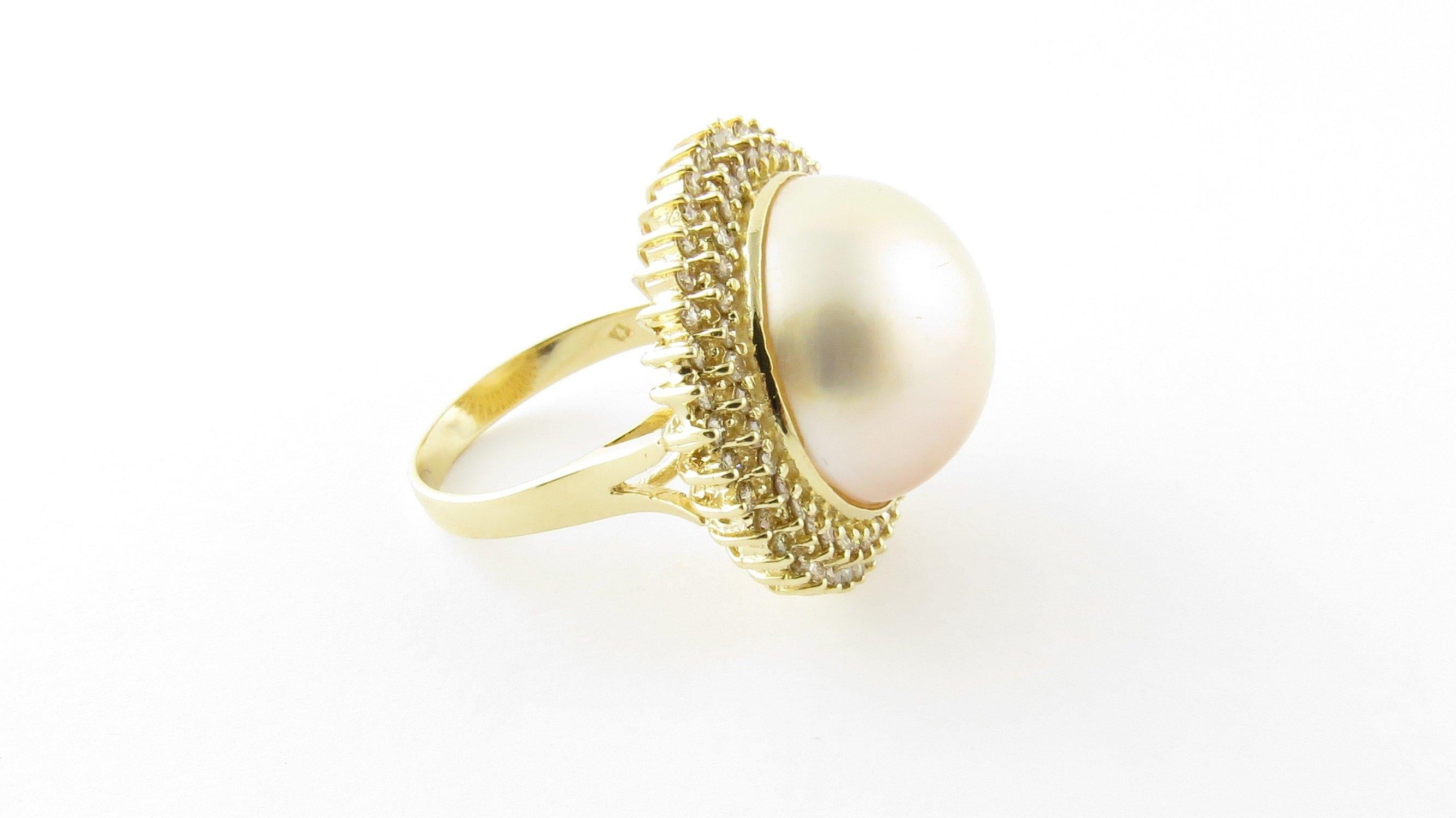 Vintage 14 Karat Yellow Gold Pearl and Diamond Ring Size 7.25- 
This spectacular ring features one Mabe pearl (17 mm) surrounded by 79 round brilliant cut diamonds (40 white outer , 39 champagne inner) set in classic 14K yellow gold. 
Top of ring