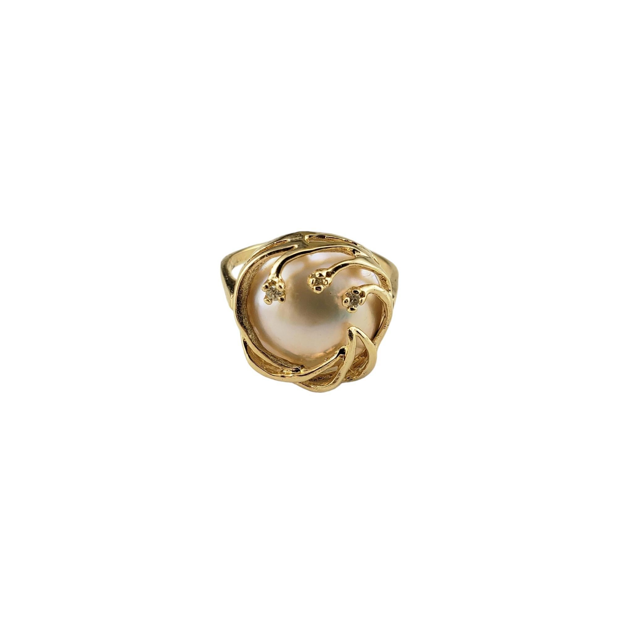 Vintage 14 Karat Yellow Gold Mabe Pearl and Diamond Ring Size 7.75-

This stunning ring features one Mabe pearl and three round single cut diamonds set in classic 14K yellow gold.
Width: 16 mm.  Shank: 2 mm.

* Matching earrings: #16726
 *Matching