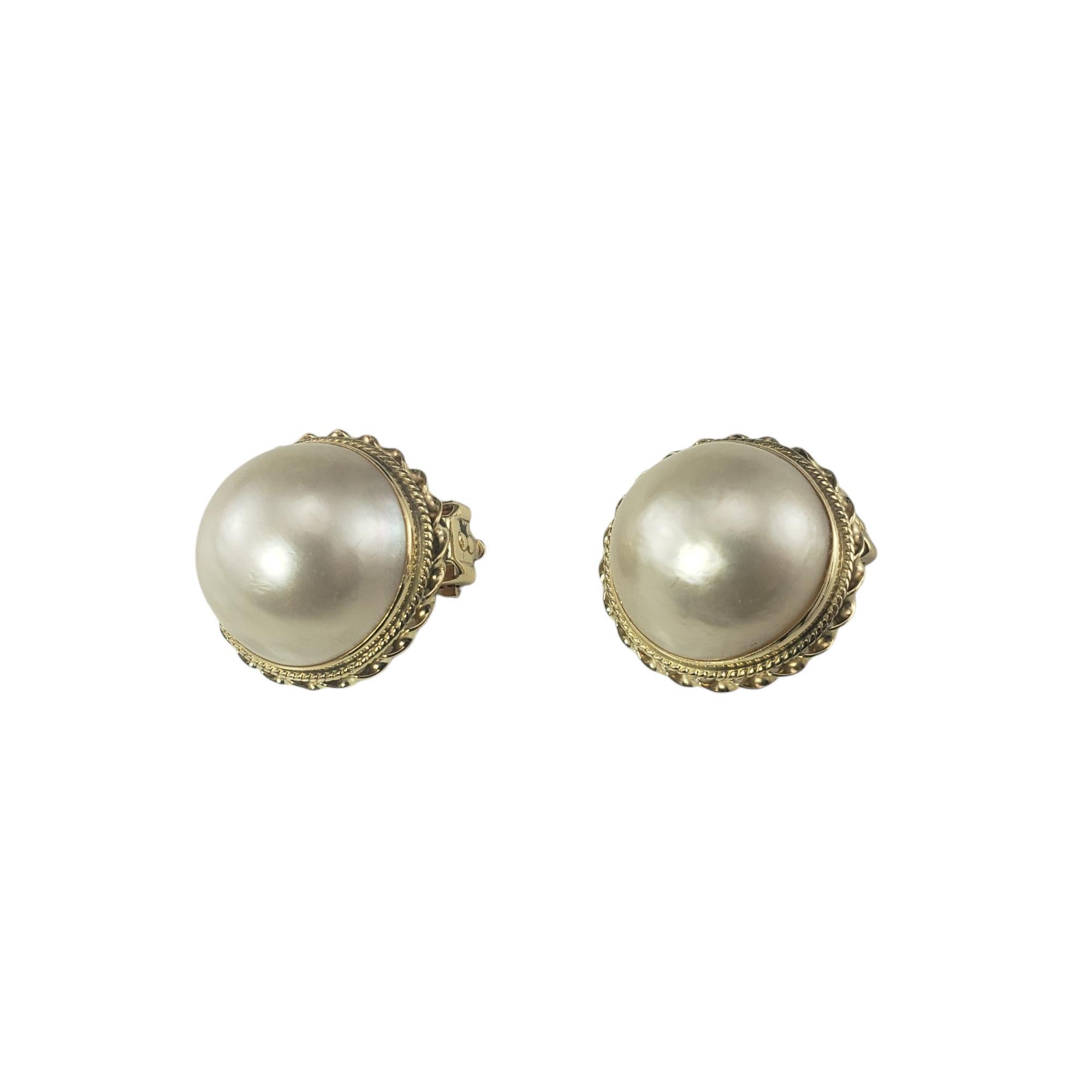 14 Karat Yellow Gold Mabe Pearl Clip On Earrings-

These elegant earrings each feature on Mabe pearl (16 mm) set in classic 14K yellow gold. Clip on closures.

Size: 18 mm

Weight: 4.6 dwt/ 7.2 gr

Stamped: 14K

Very good condition, professionally