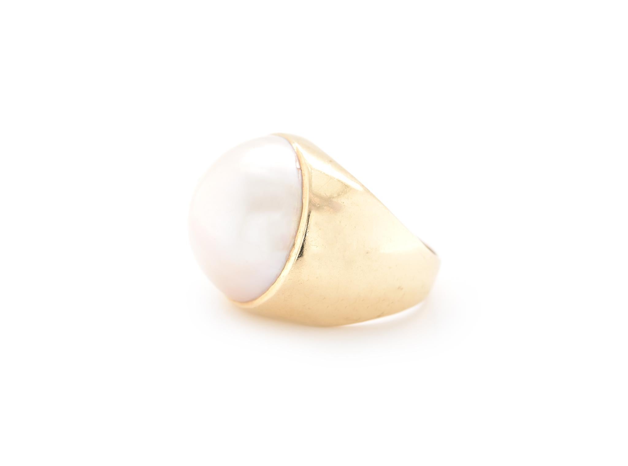 Designer: custom design
Material: 14k yellow gold
Pearl: Mabe pearl = 17.70mm
Ring Size: 6 ¾ (please allow two additional shipping days for sizing requests)
Dimensions: ring top measures 19mm wide 
Weight: 11.30 grams