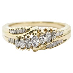 Anello nuziale in oro giallo 14 carati con marquise e baguette