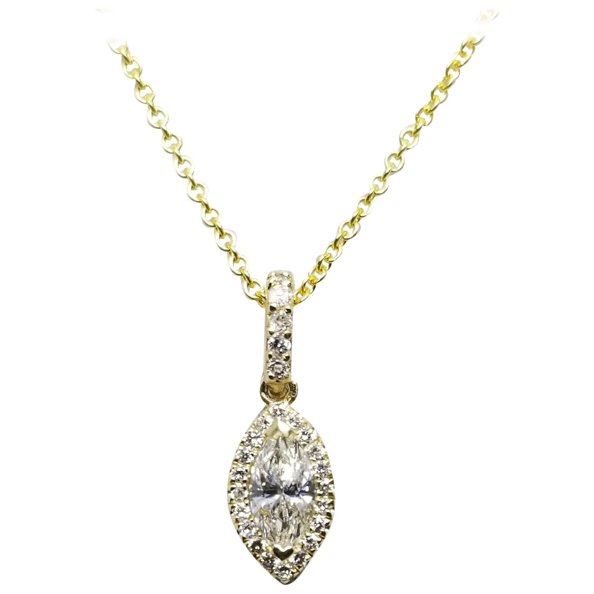 14 Karat Yellow Gold Marquise and Diamond Halo Pendant Total Weight .55pts
