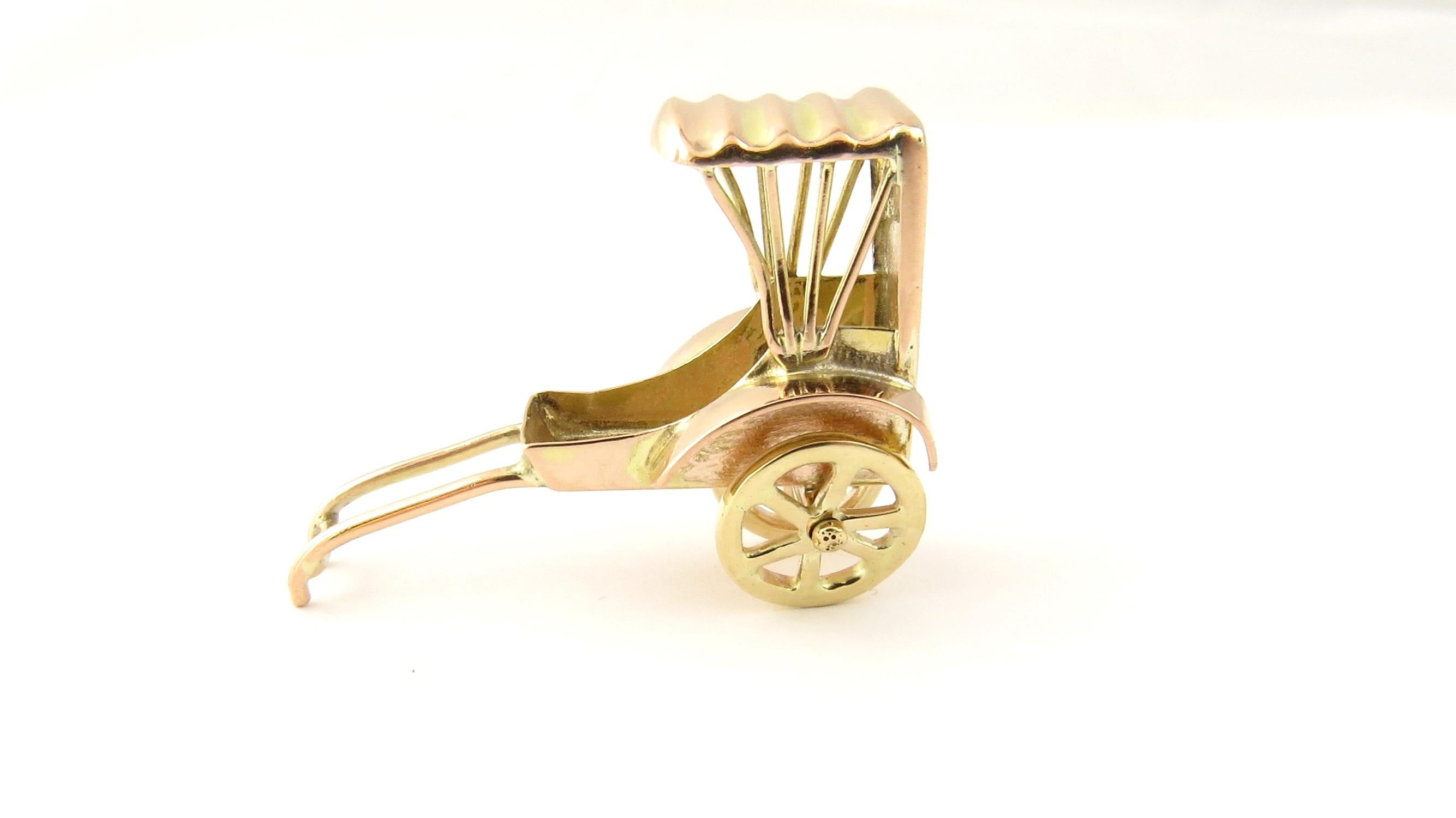 Vintage 14 Karat Yellow Gold Mechanical Rickshaw Charm

Perfect addition to your travel charm collection!

This lovely 3D charm features a miniature rickshaw with moving wheels beautifully detailed in 14K yellow gold.

Size: 27 mm x 33 mm

Weight: