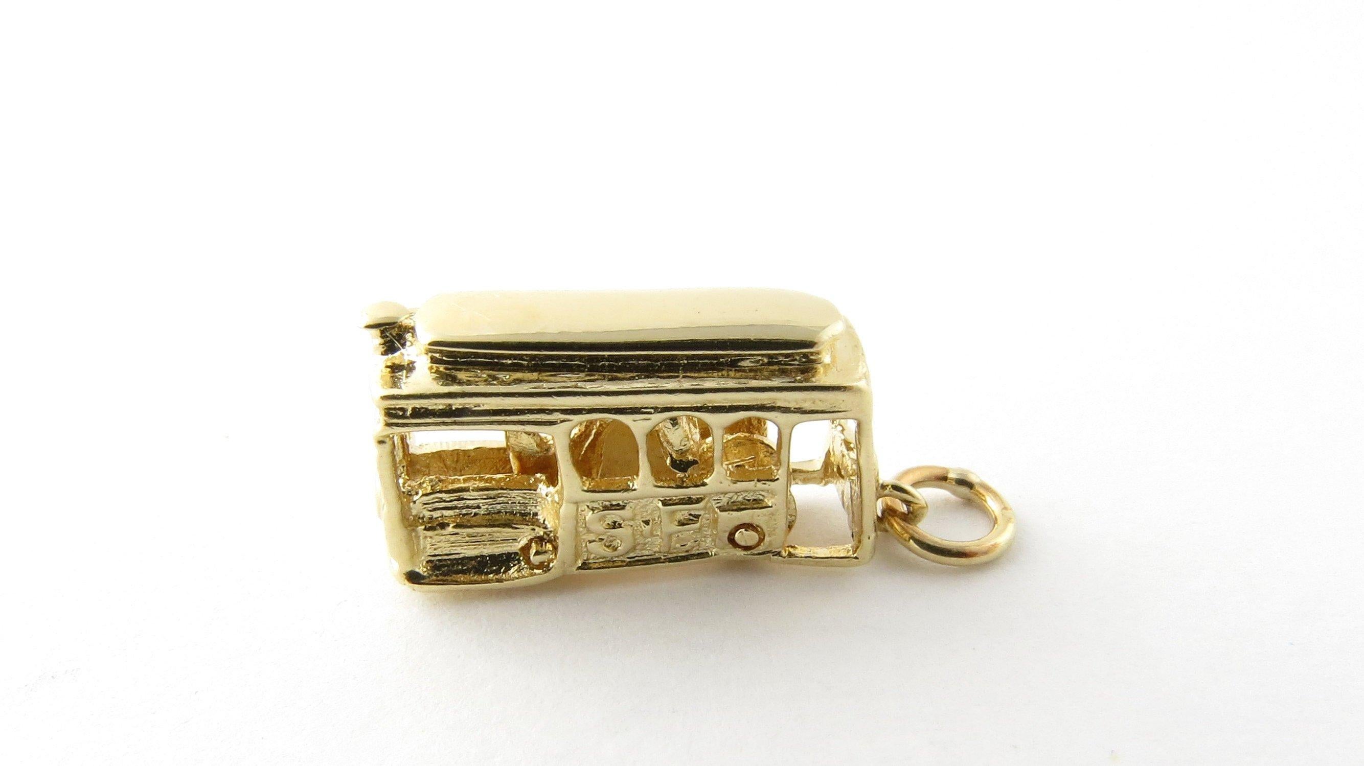 Vintage 14 Karat Yellow Gold Mechanical San Francisco Cable Car Charm- 
Take a ride on the trolley! 
This 3D charm features a miniature San Francisco cable car with moving wheels and driver! Meticulously detailed in 14K yellow gold. 
Size: 11 mm x