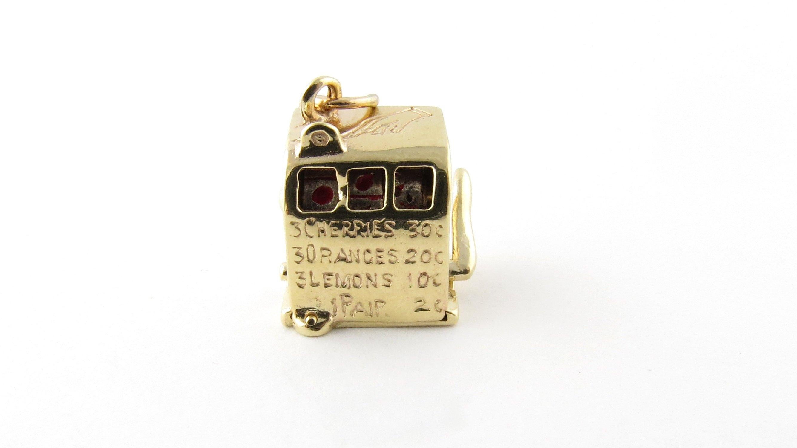 Vintage 14 Karat Yellow Gold Mechanical Slot Machine Charm- 
Try your luck! 
This lovely 3D slot machine features a working lever that spins the three inner wheels to reveal colored fruits. Meticulously detailed in 14K yellow gold. 
Size: 13 mm x 11