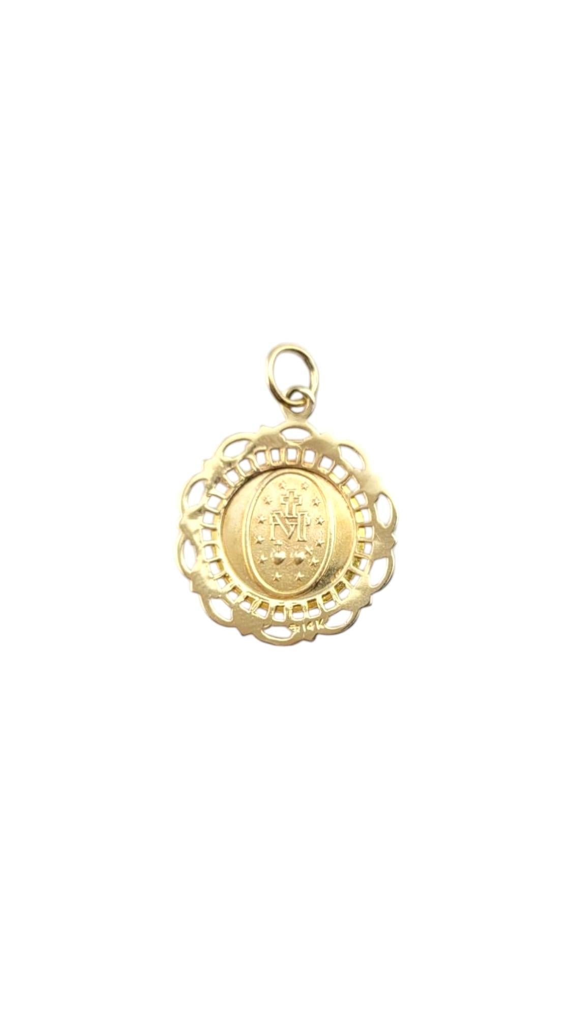 14K Yellow Gold Miraculous Medal Pendant-

14K Yellow Gold Miraculous Medal Pendant – Crafted in radiant 14K yellow gold, this exquisite pendant features a beautifully detailed design that exudes elegance and devotion. With its polished finish and