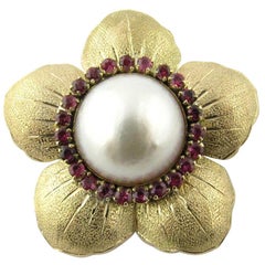 14 Karat Yellow Gold Mobe Pearl and Ruby Flower Pendant