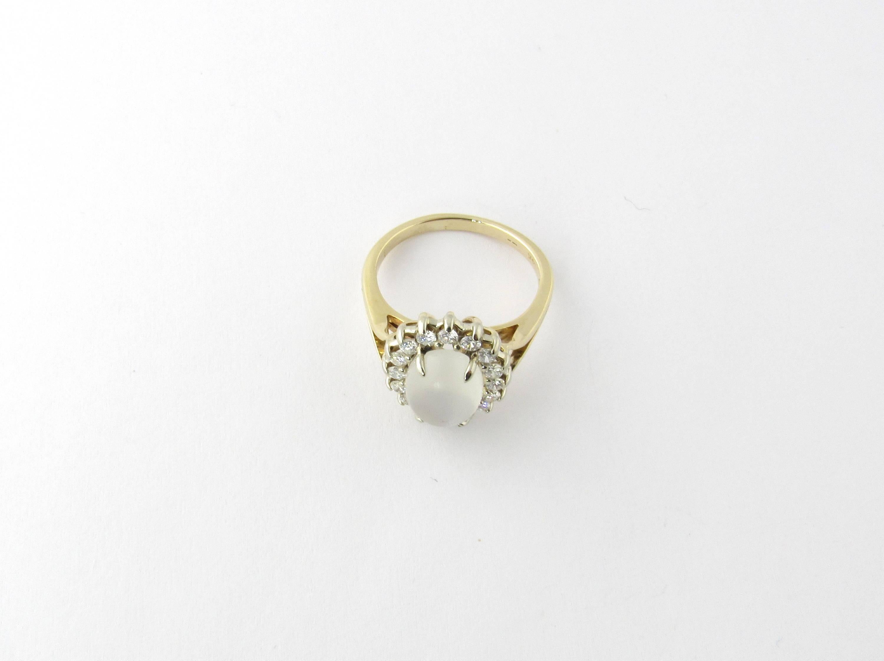 Vintage 14 Karat Yellow Gold Moonstone Ring Size 7.75- 
This stunning ring features an oval moonstone (10 mm x 8 mm) surrounded by 16 round brilliant cut diamonds (.06 ct. each) set in 14K yellow gold. 
Approximate total diamond weight: 1 ct.