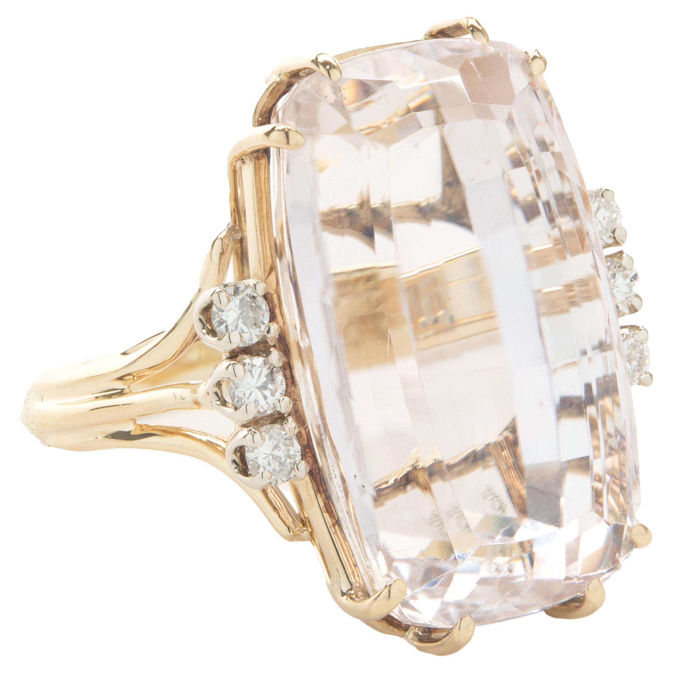 Designer: custom
Material: 14K yellow gold
Diamond: 6 round brilliant cut = .12cttw
Color: G
Clarity: SI1
Morganite: 19.50ct
Ring Size: 5 (please allow up to 2 additional business days for sizing requests)
Dimensions: ring top measures 23mm 
Weight: