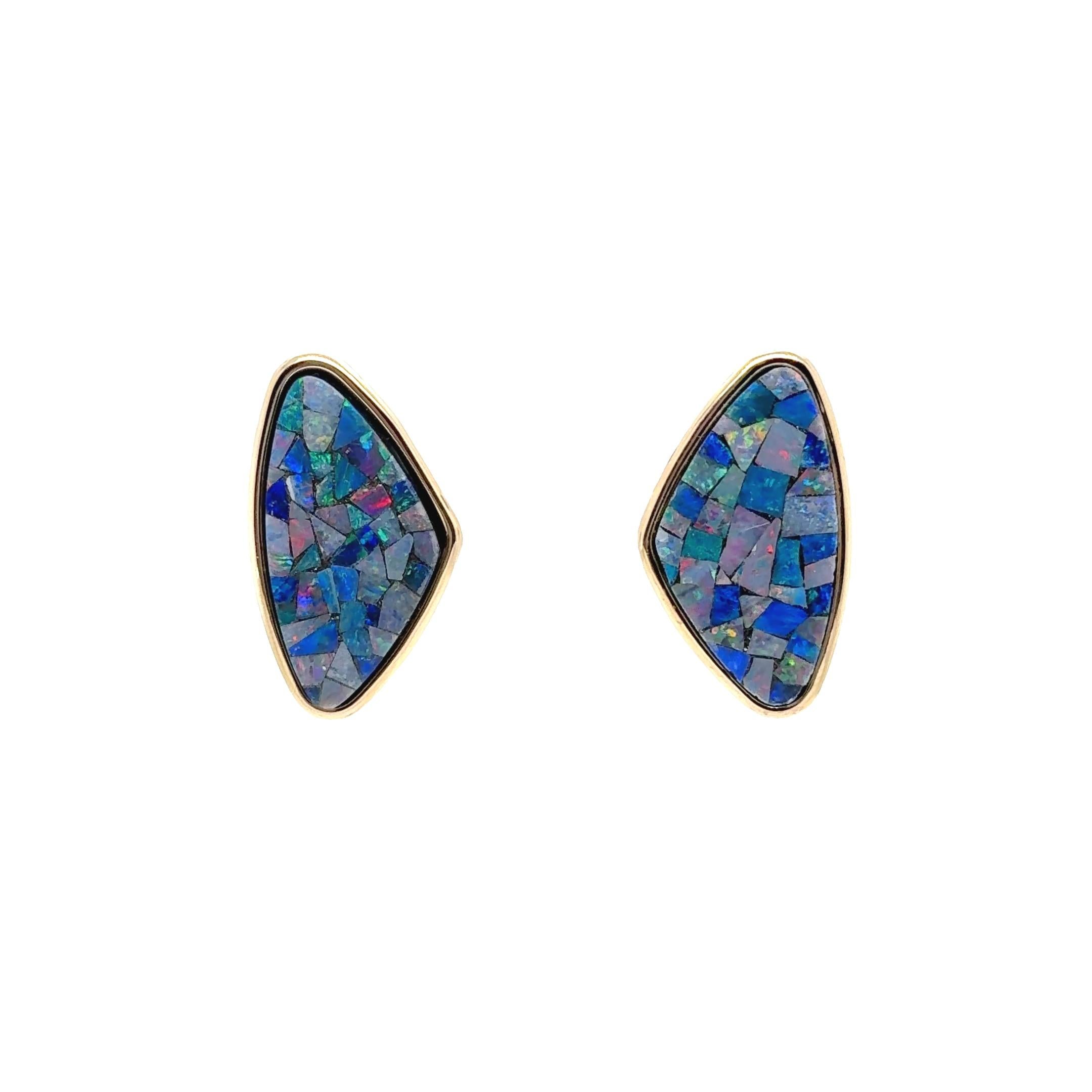 Add a bold and artistic touch to your jewelry collection with these mesmerizing 14 karat yellow gold Mosaic Opal earrings. Designed to captivate, each earring features a stunning mosaic of natural opals measuring approximately 33mm x 18mm. These