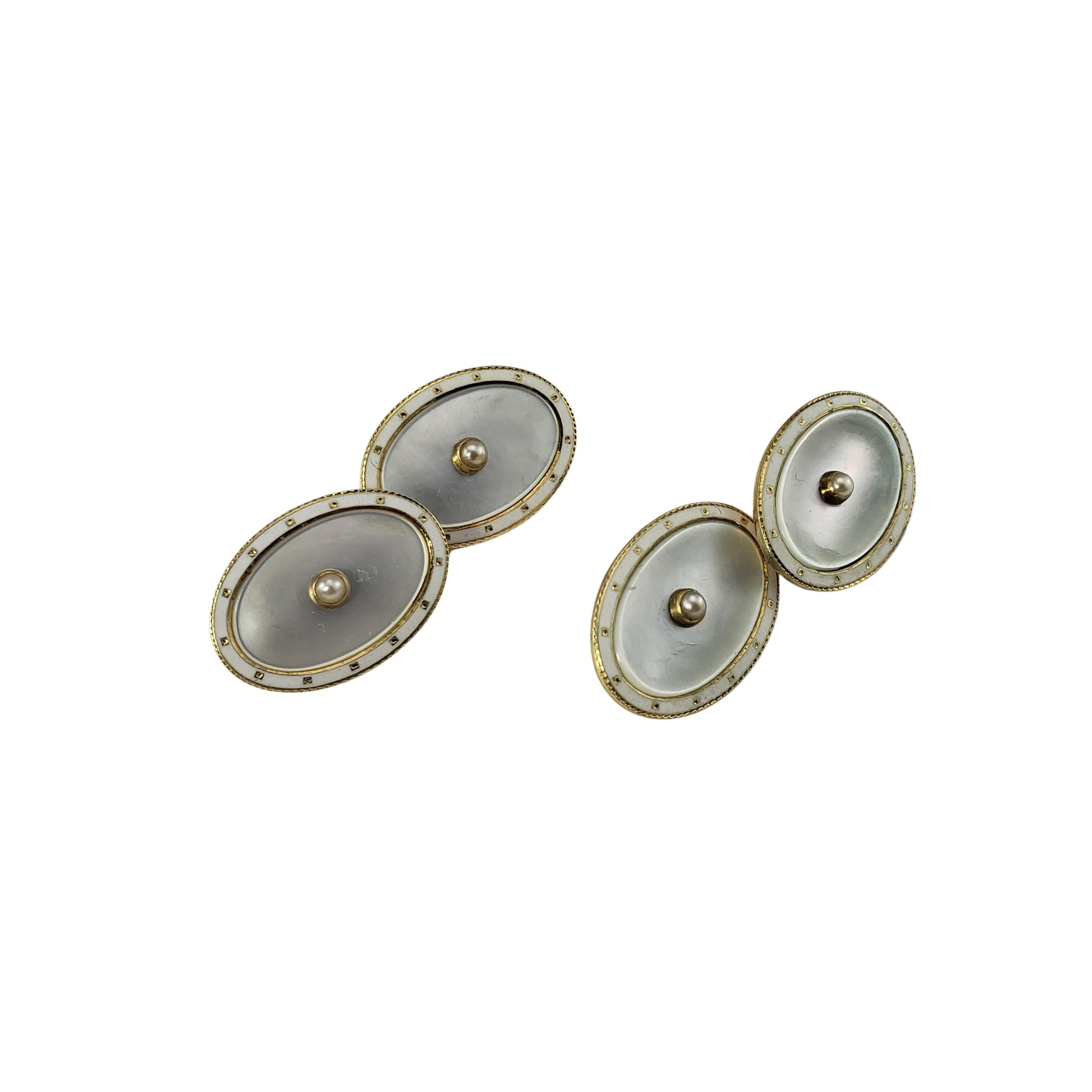 14 Karat Yellow Gold Mother of Pearl and Pearl Cufflinks-

These elegant cufflinks each feature one round pearl and beautifully detailed inlaid mother of pearl.

Size:  18 mm x 13 mm

Weight:  6.1 dwt. /  9.6 gr.

Stamped:  14K

Very good condition,
