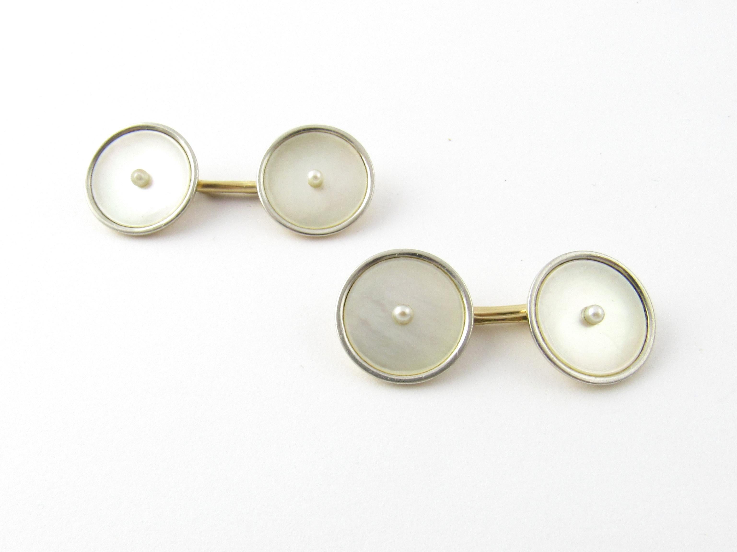 14 Karat Yellow Gold Mother of Pearl Cufflinks-

These elegant cufflinks are each accented with mother of pearl and one seed pearl.  Beautifully detailed in 14K yellow gold.

Size:  14 mm

Weight:  4.6 dwt. /  7.3 gr. 

Stamped: 14K 

Very good