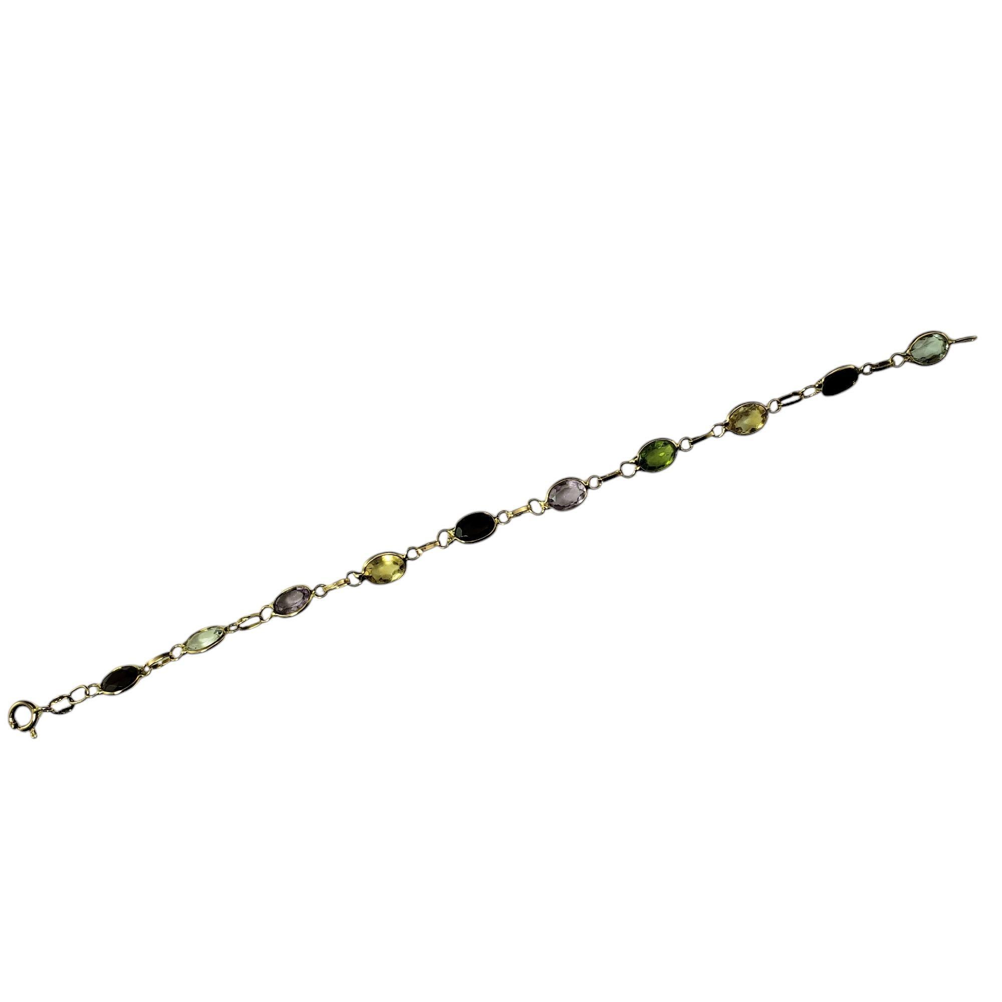 14 Karat Yellow Gold Multi-Colored Gemstone Bracelet-

This vibrant bracelet features 10 multi-colored gemstones set in a 14K yellow gold. Perfect for adding a pop of color to any outfit. 

Width: 6 mm.

Size: 6.75 inches

Weight: 2.4 dwt./ 3.8