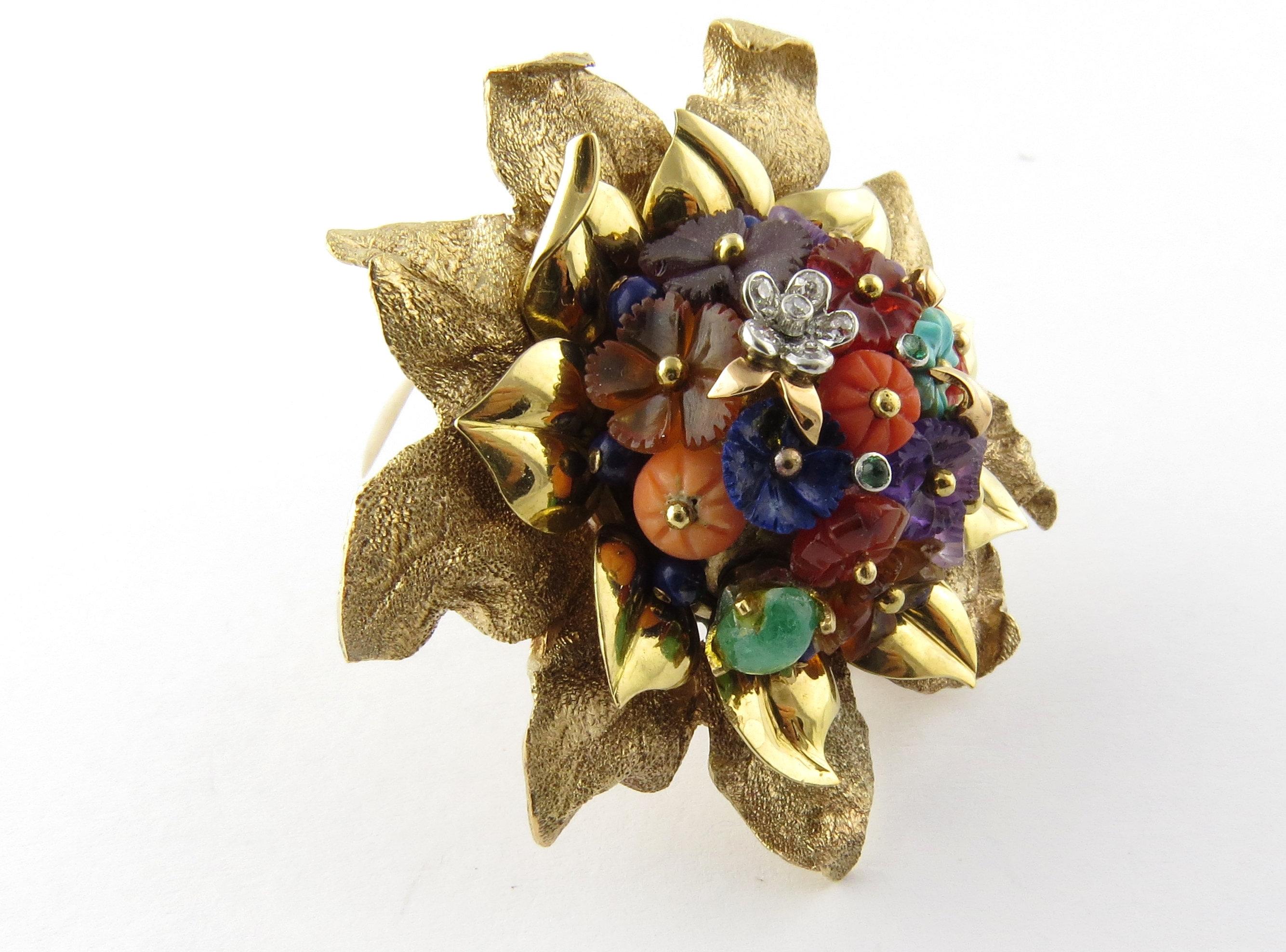 Vintage 14K Yellow Gold Multi Gem Flower Brooch Pin

 20.8 dwt 32.5 g 

About 50 mm in diameter,

 18 mm thick 

Marked 14K 

Gold Center of flower has many different floral shaped gemstones including, amethyst, diamond, lapis, jade and coral 

The