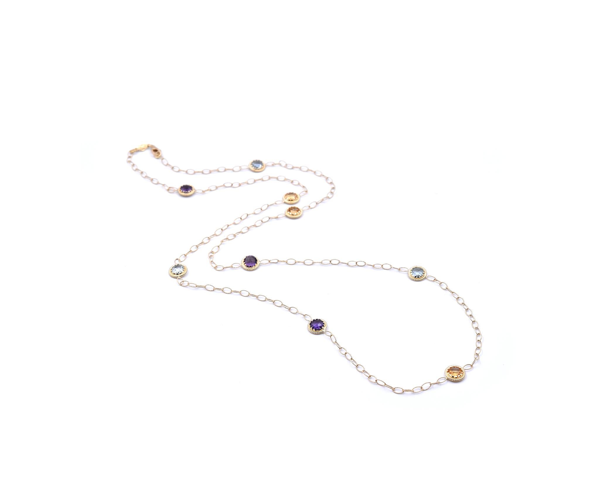 Material: 14k yellow gold
Gemstone: blue topaz, amethyst, citrine
Dimensions: necklace is 30-inches in length
Weight: 8.77 grams
