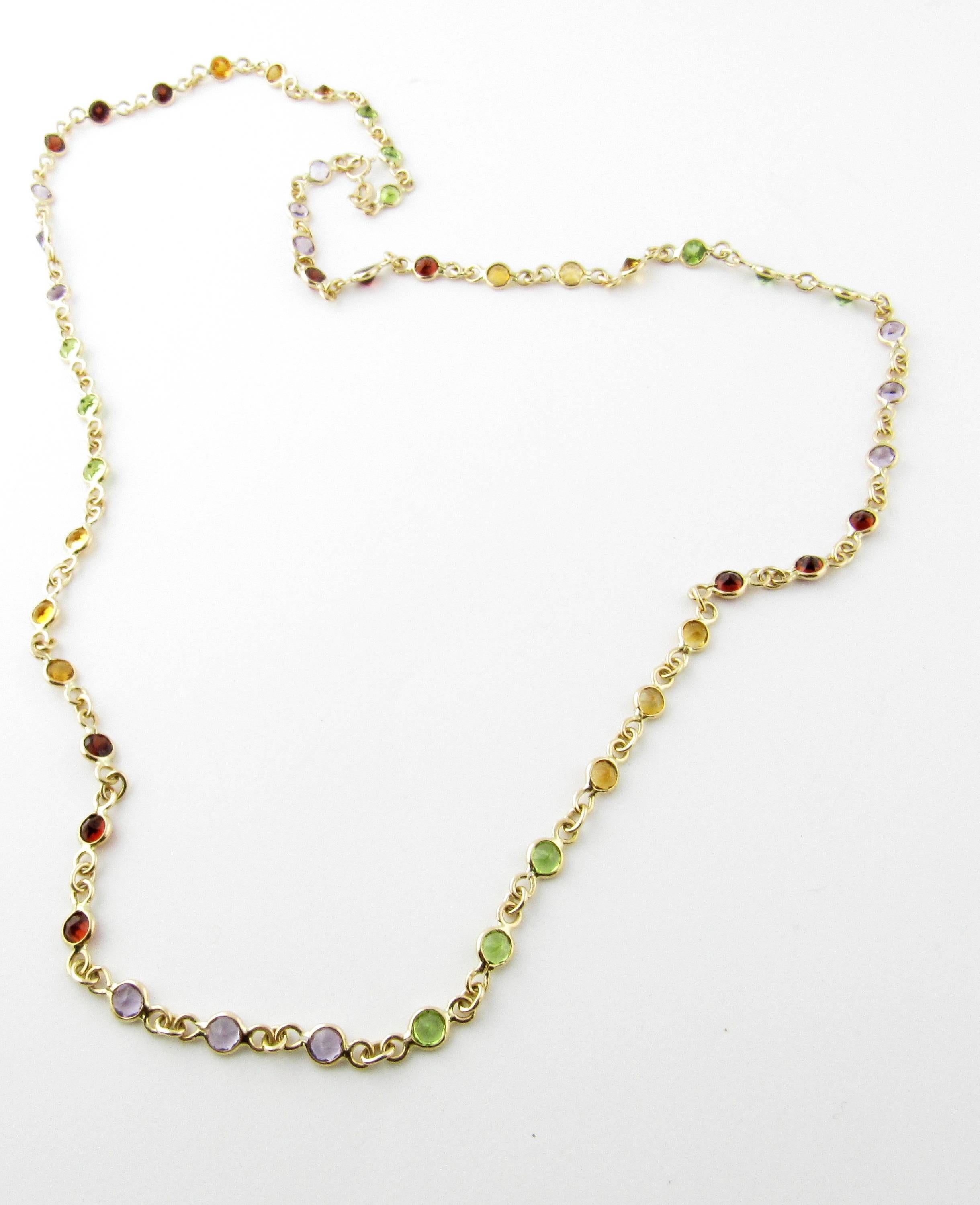 Vintage 14 Karat Yellow Gold Multi-Colored Gemstone Necklace- 
This lovely necklace features a bright array of gemstones (5 mm each) set in a beautifully detailed 14K yellow gold chain. 
Size:  24.75 inches 
Weight: 8.6 dwt. /  13.4 gr. 
Hallmark: