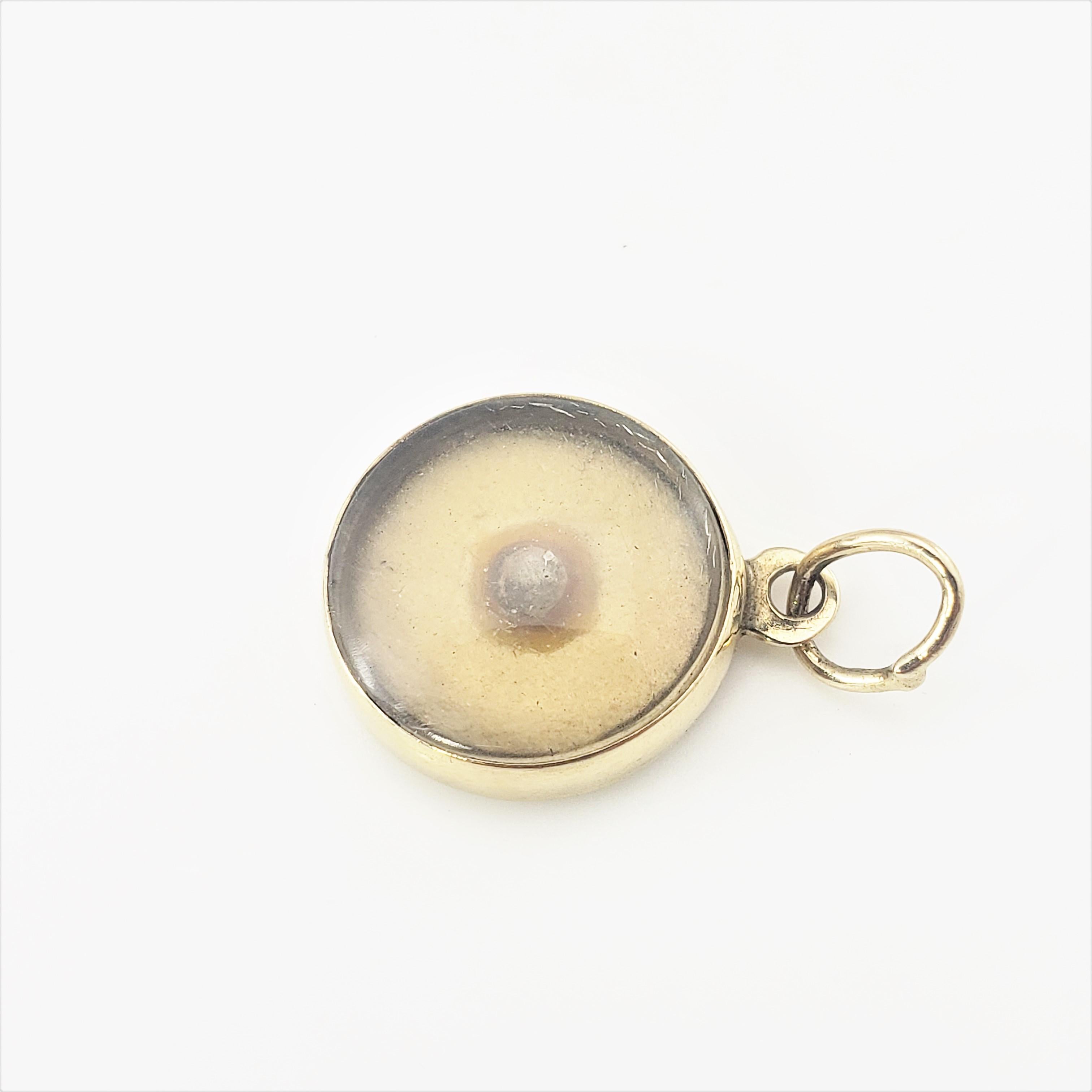 14 Karat Yellow Gold Mustard Seed Charm-

This lovely charm features a mustard seed with crystal cover set in 14K yellow gold.  Back of charm reads,
 