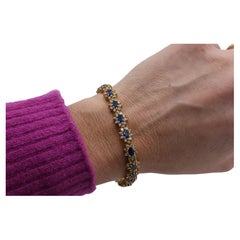 14 Karat Yellow Gold Natural Diamond & Blue Sapphire Halo Tennis Line Bracelet