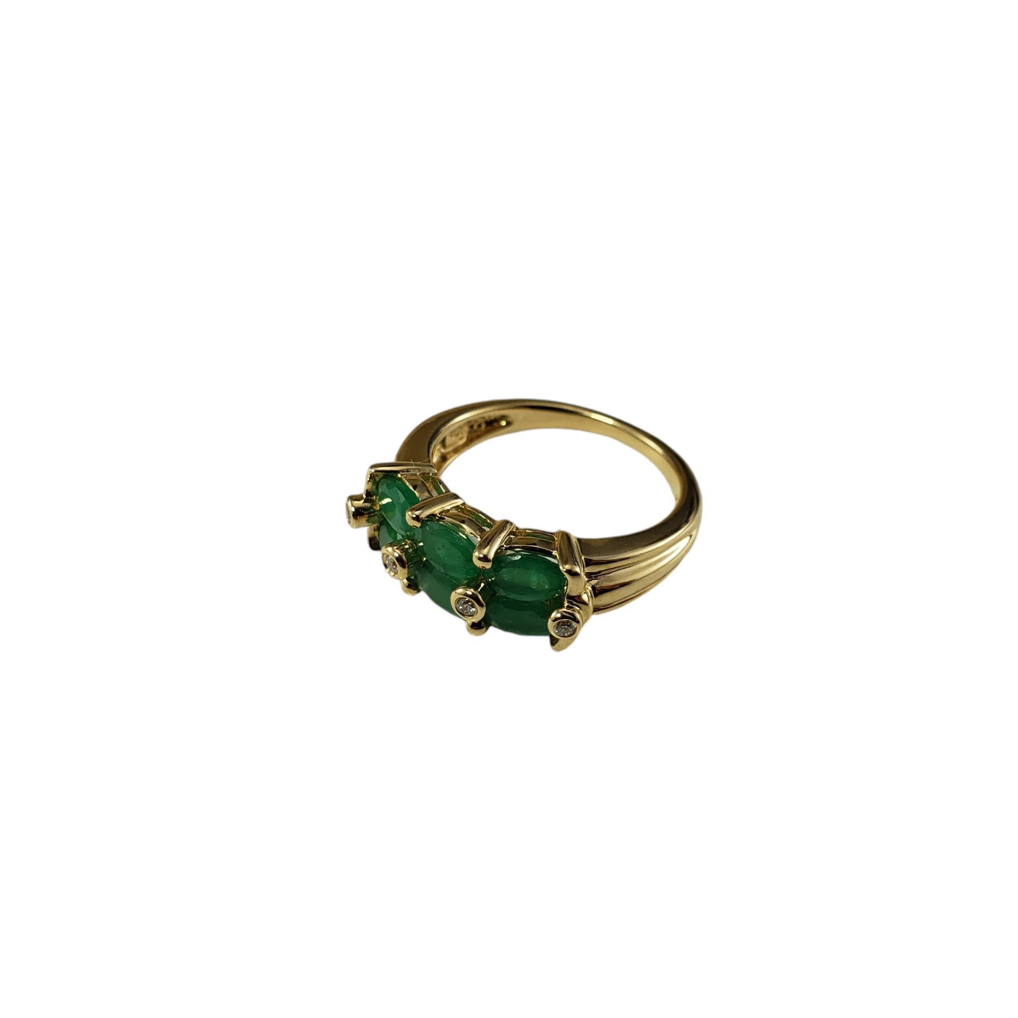 14 Karat Yellow Gold Emerald and Diamond Ring Size 5.75

This stunning ring features six oval emeralds (5 mm x 3 mm each) and four round brilliant cut diamonds set in 14K yellow gold. Width: 7 mm. Shank: 2 mm.

Approximate total diamond weight: .03