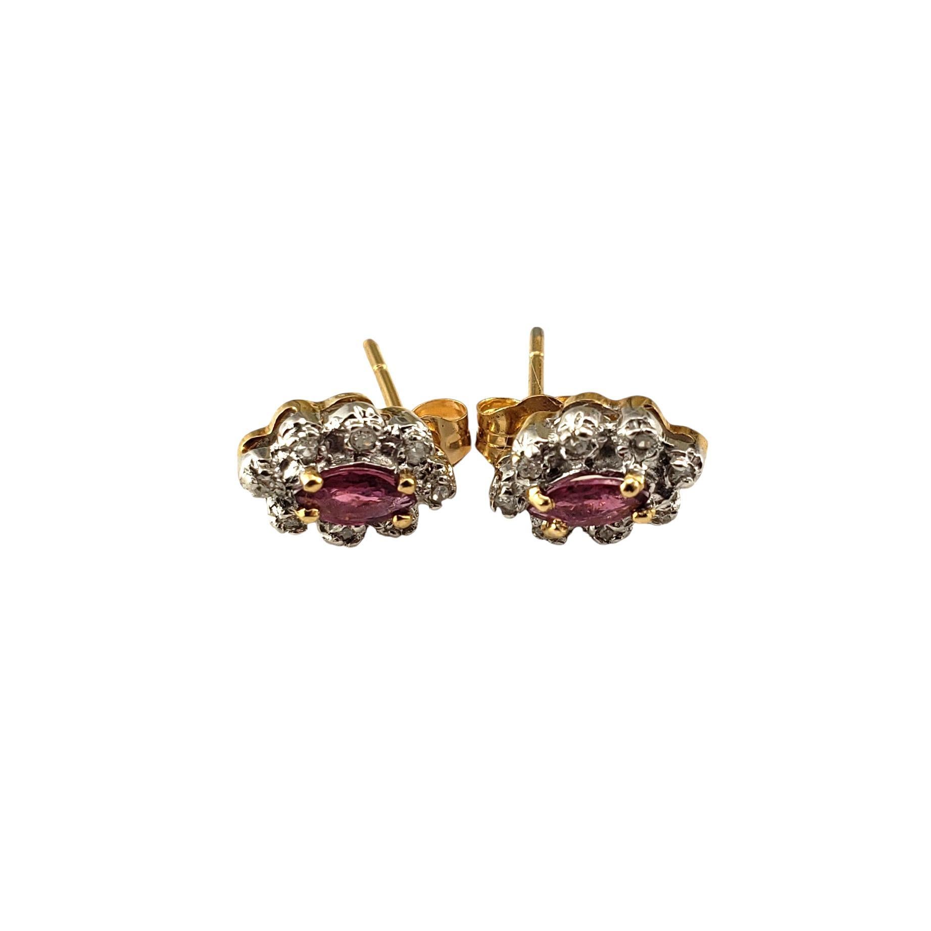 14 Karat Yellow and White Gold Ruby and Diamond Stud Earrings-

These lovely stud earrings each feature one marquis cut natural ruby surrounded by eight round single cut diamonds. 

Push back closures.

Approximate total diamond weight: .06 ct. -
