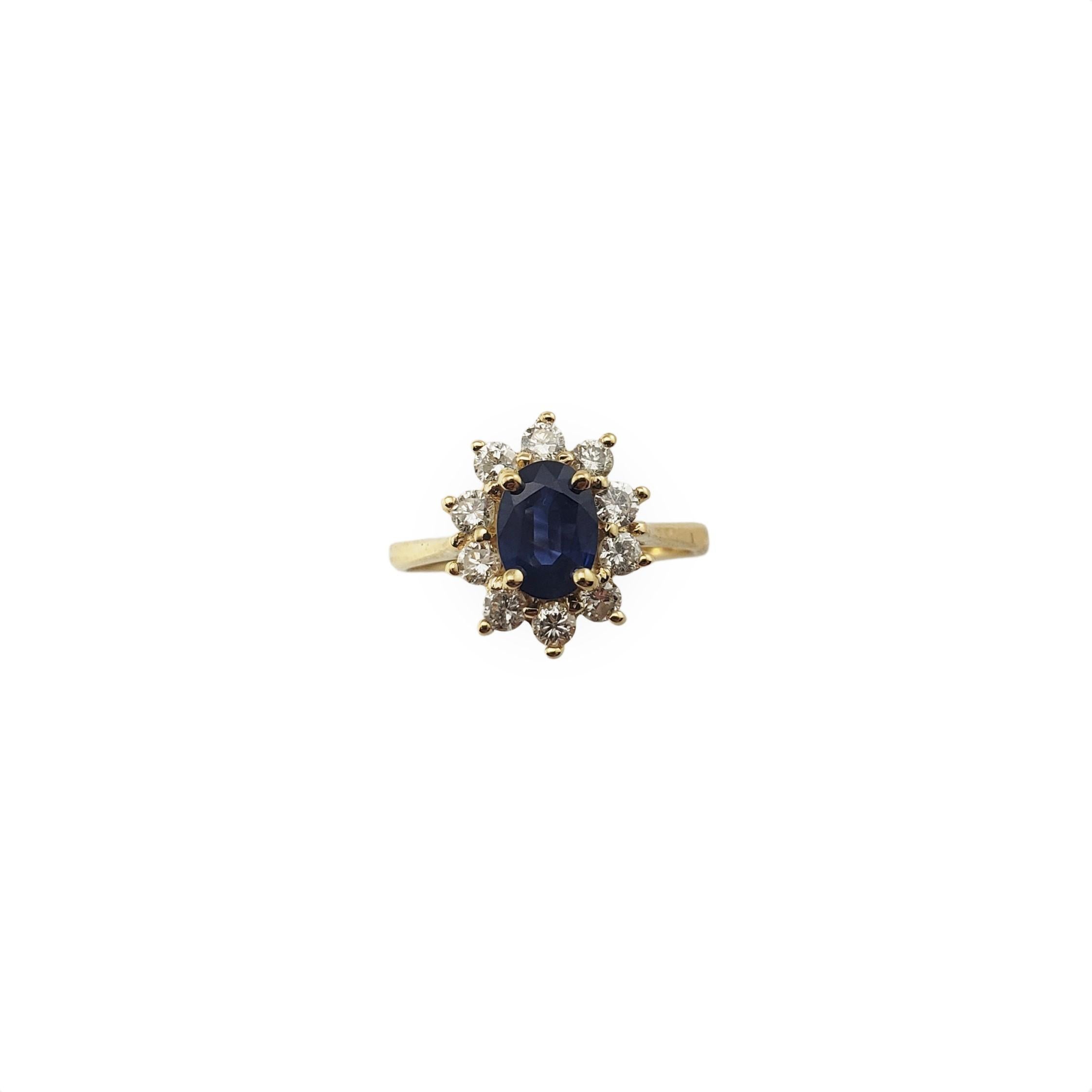 This lovely ring features one oval sapphire (7 mm x 5 mm) surrounded by ten round brilliant cut diamonds.

Width:  12 mm.

Shank:  2.5 mm.

Approximate total diamond weight:   .50 ct.

Diamond color: G

Diamond clarity:  SI1-I1

Ring Size: