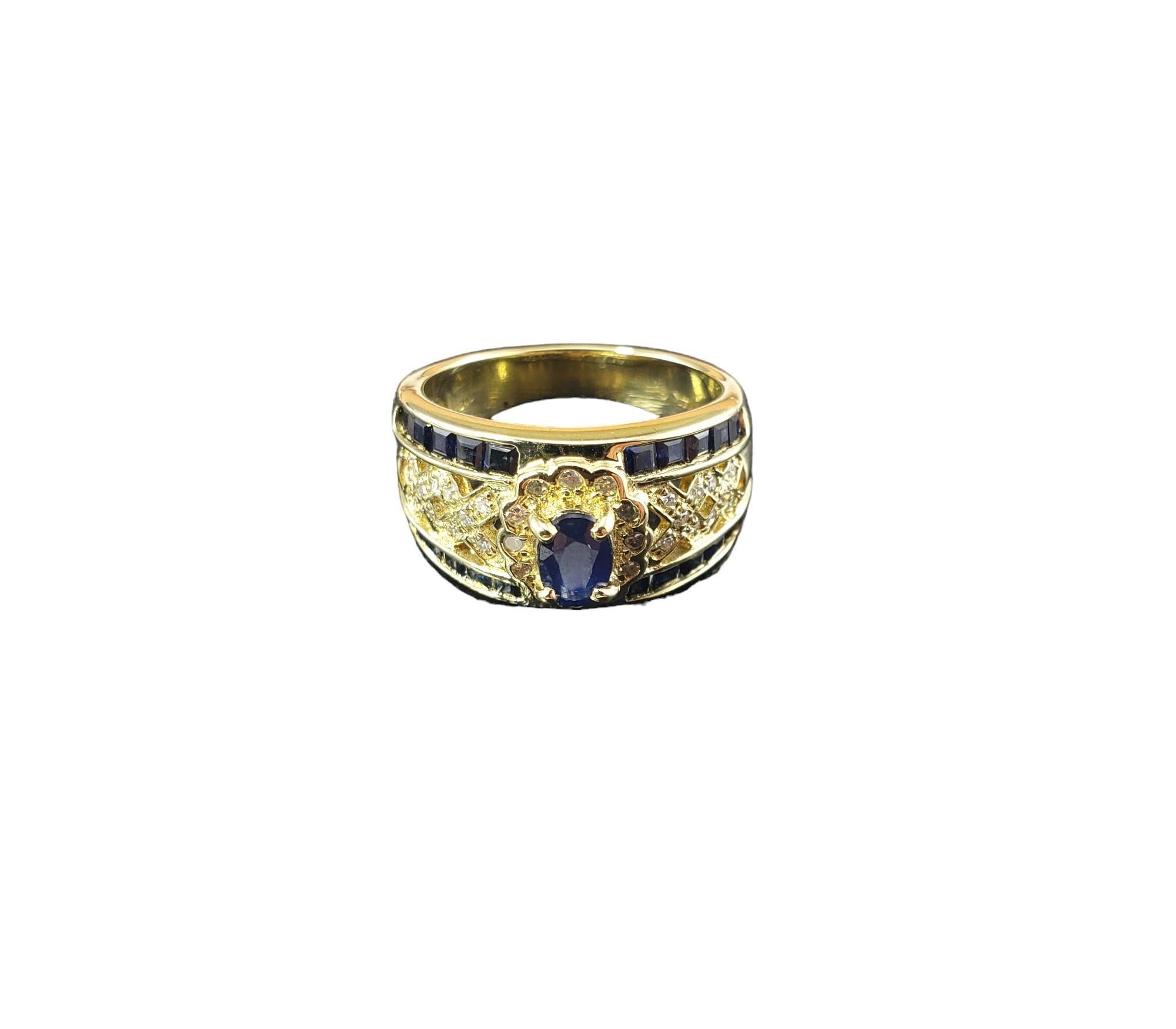 Vintage 14K Yellow Gold Sapphire and Diamond Ring Size 6.75-

This sparkling ring features one oval sapphire (6 mm x 5 mm), 20 square cut sapphires and 32 round single cut diamonds set in classic 14K yellow gold. 

Width: 11 mm.  Shank: 4