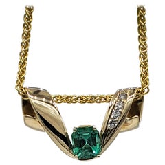 14 Karat Yellow Gold Omega Necklace Enhancer, Vibrant Natural Emerald, Diamonds